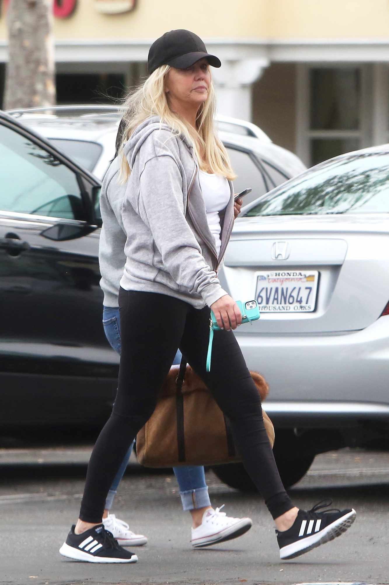 Heather Locklear seen running errands in Los Angeles, CA. She stopped to do some Christmas shopping and stepped out while face-timing someone while her assistant did the shopping after that she stopped to pharmacy store to pick up some pills. 03 Dec 2019