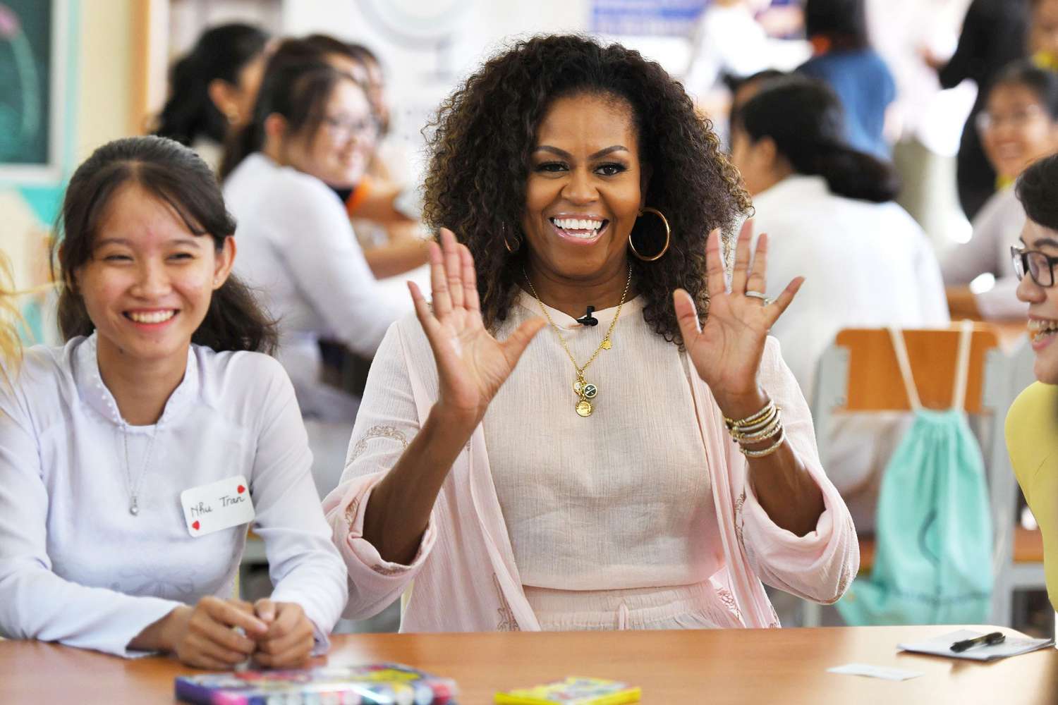 Former US first lady Michelle Obama (C) smiles as she meets wiith Vietnamese students in Can Giuoc district, Long An province, Vietnam 09 December 2019.