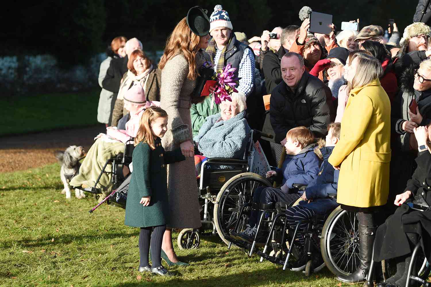 The Duchess of Cambridge and Princess Charlotte meet well wishers after attending the Christmas Day morning church service at St Mary Magdalene Church in Sandringham, Norfolk. (Photo by Joe Giddens/PA Images via Getty Images)