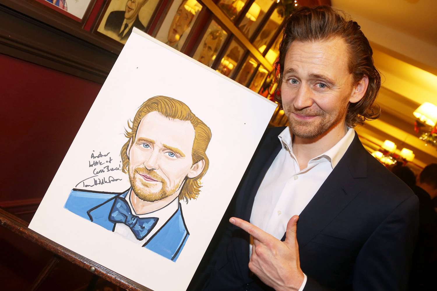 Tom Hiddleston poses as he is honored for his performanve in "Betrayal" on Broadway at Sardi's on December 5, 2019 in New York City