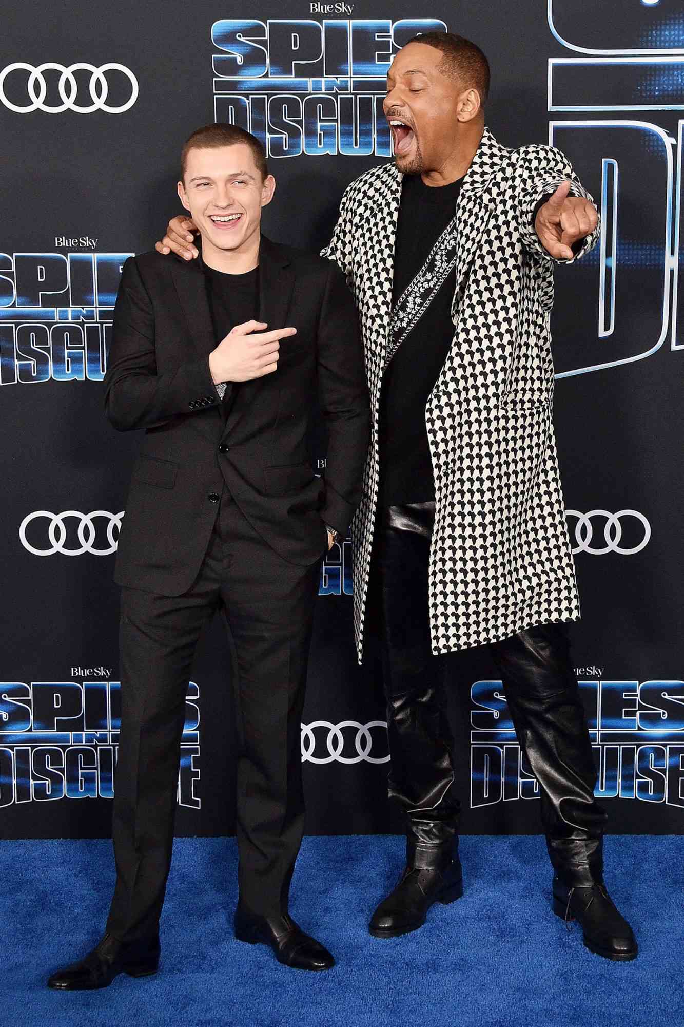 Will Smith and Tom Holland arrive at the premiere of 20th Century Fox's "Spies In Disguise" at El Capitan Theatre on December 4, 2019 in Los Angeles, California