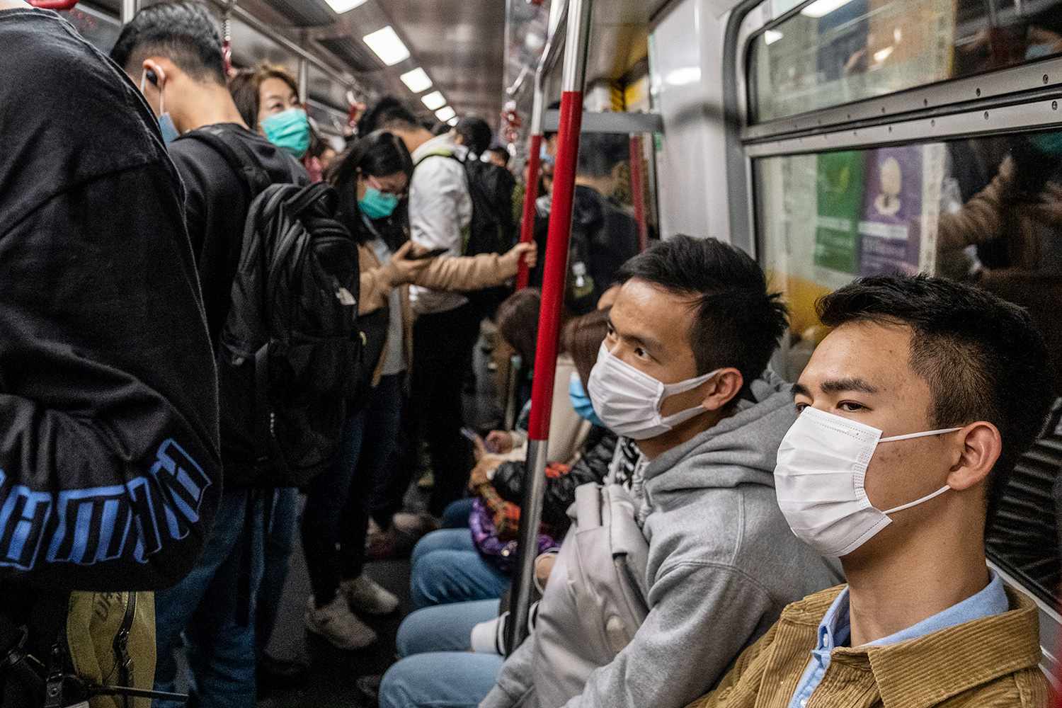 People wearing mask are seen riding the MTR train on January 22, 2019 in Hong Kong, China