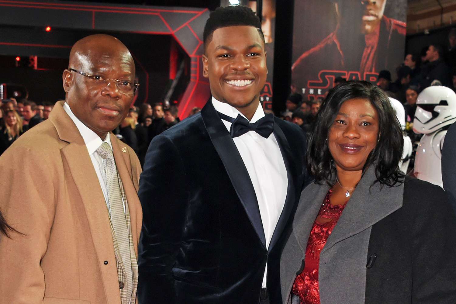 John Boyega (C) poses with parent Samson Boyega (L) and Abigail Boyega