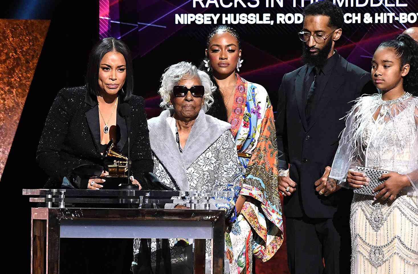 Lauren London (L), wife of late US rapper Nipsey Hussle, Samiel Asghedom (2nd R), his brother, his grandmother Margaret Boutt