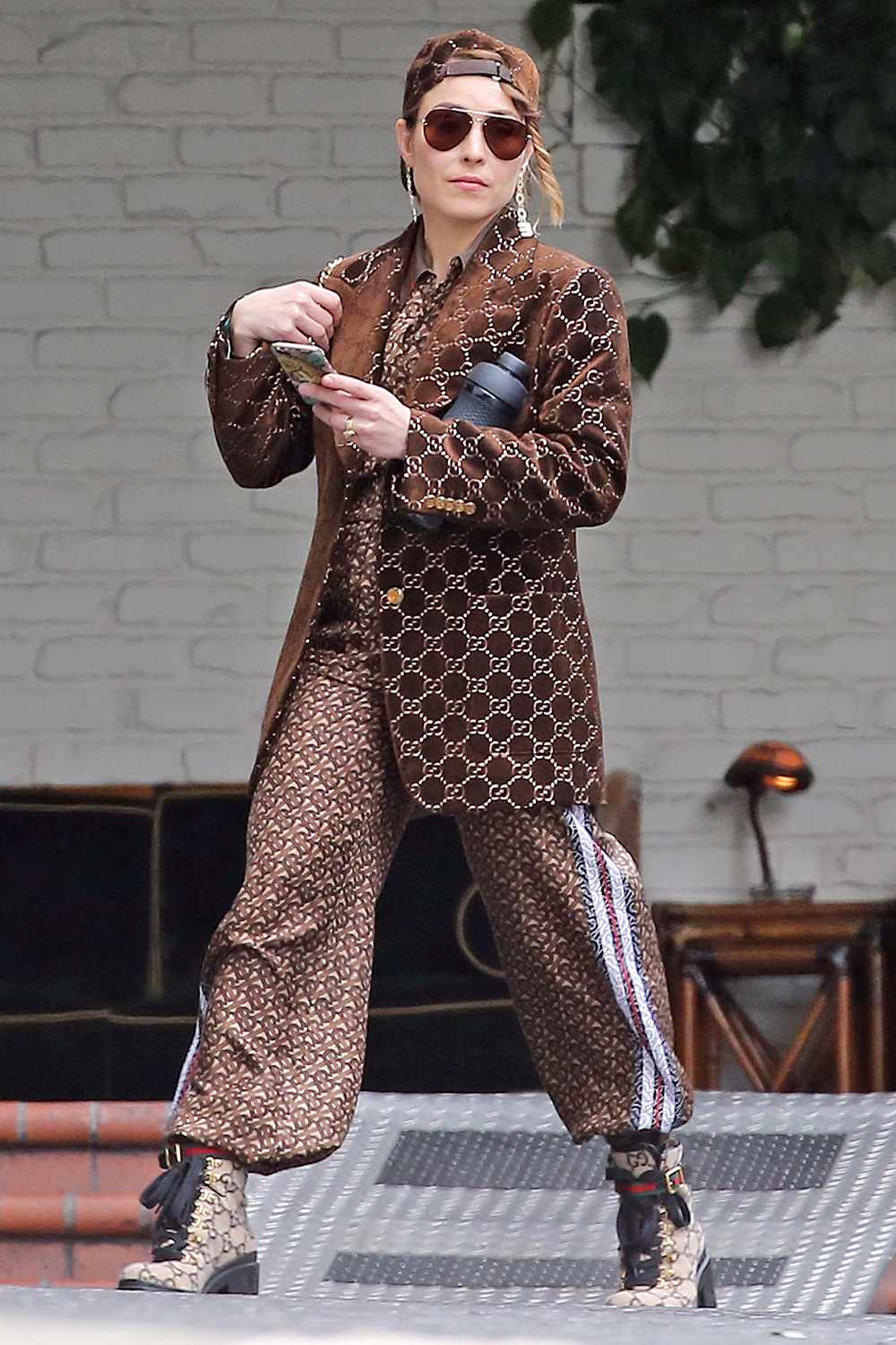 Noomi Rapace from the Girl with the Dragon Tattoo movie's steps out in head-to-toe Gucci in Los Angeles, CA.