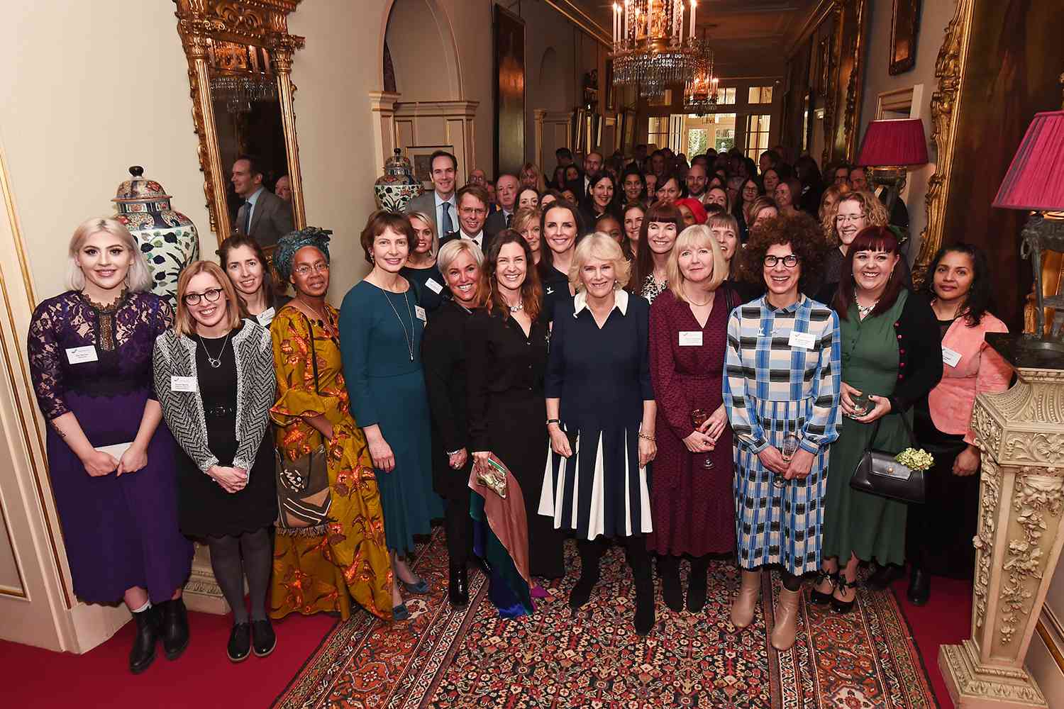 Camilla, Duchess of Cornwall poses with CEO of SafeLives Suzanne Jacob and guests of a reception to acknowledge the 15th anniversary of domestic abuse charity SafeLives at Clarence House on February 12, 2020 in London, England