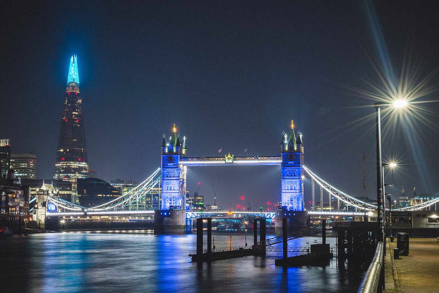 The Shard and Tower Bridge are lit up blue to show appreciation and support for NHS staff during the COVID-19 outbreak March 26, 2020 in London, United Kingdom