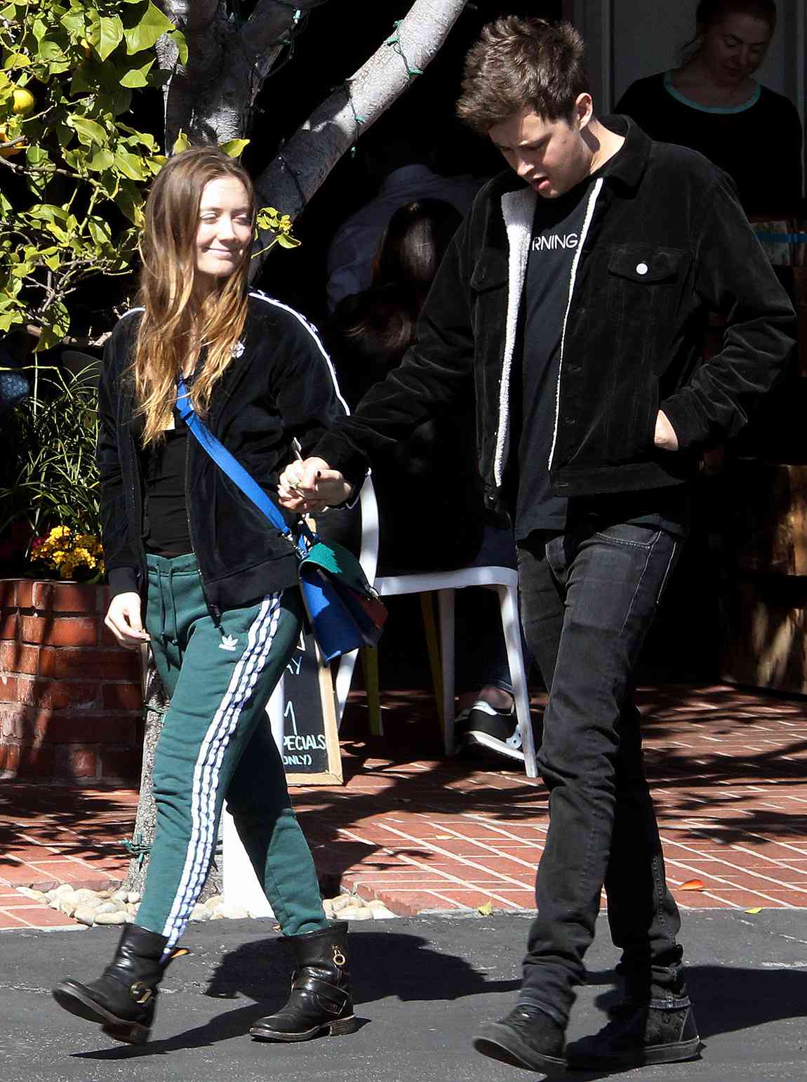 Billie Lourd looking very happy in Love as she leaves Mauro's cafe, holding hand with boyfriend Austen Rydell