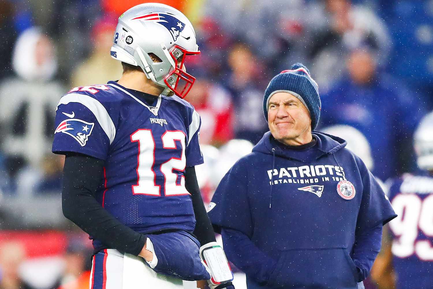 Tom Brady #12 talks to head coach Bill Belichick