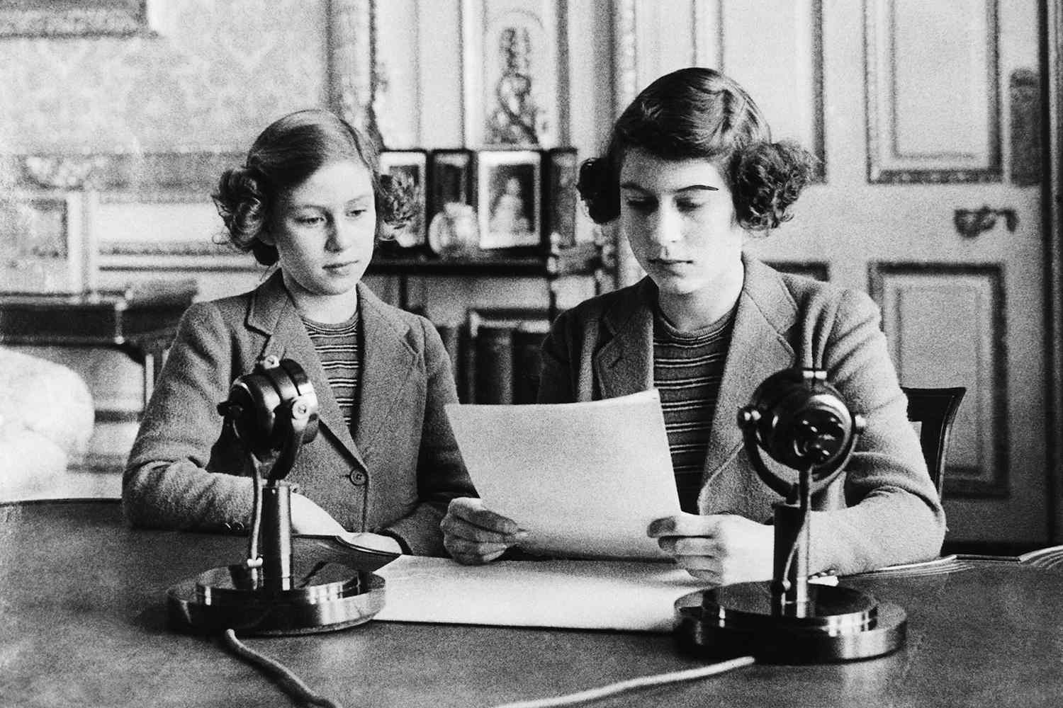 British Royal Family. Future Countess of Snowdon Princess Margaret and Future Queen of England Princess Elizabeth, preparing for a radio address, circa early 1940s.