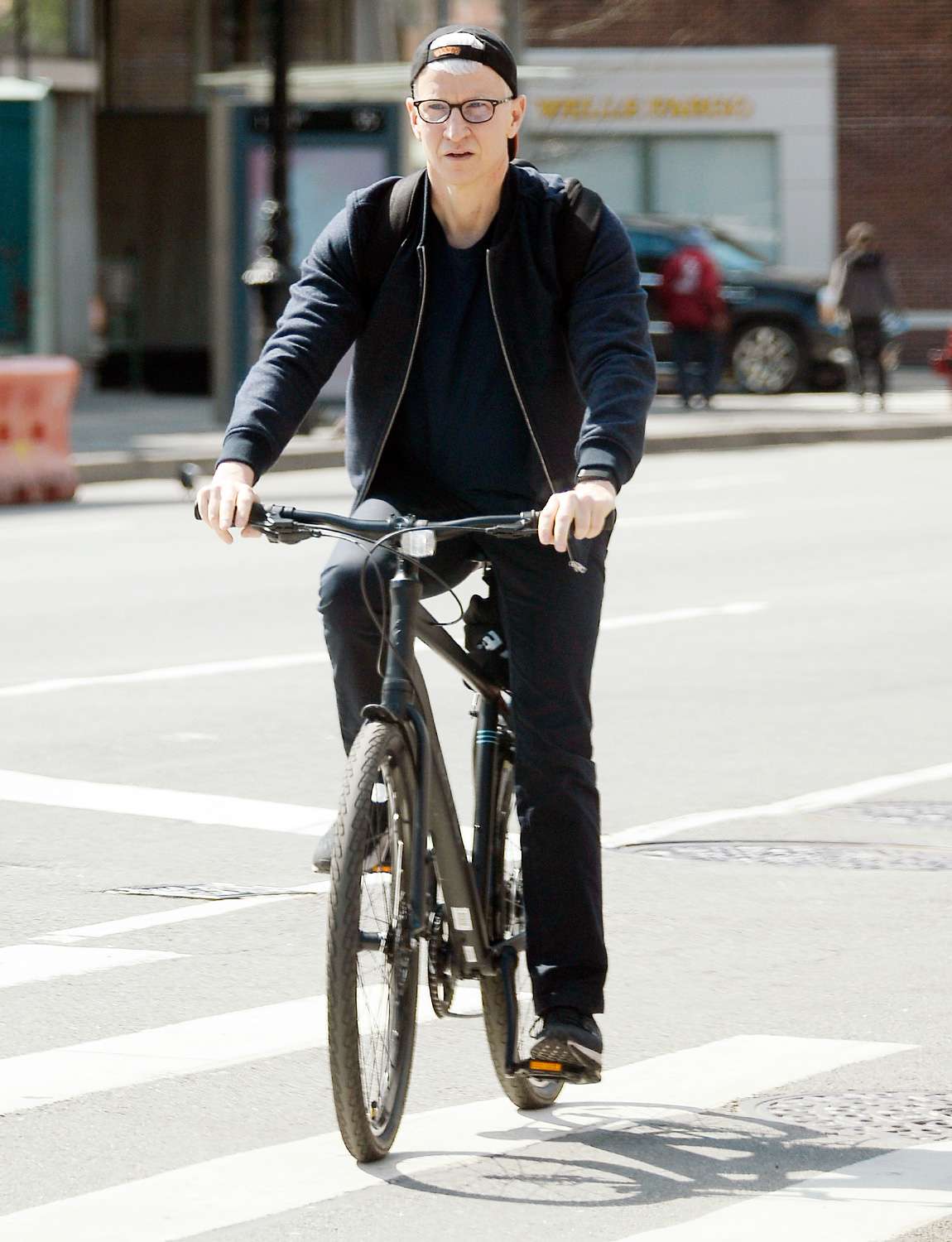 Anderson Cooper seen biking without any face mask or protective covering amidst the Corona Virus pandemic in New York City
