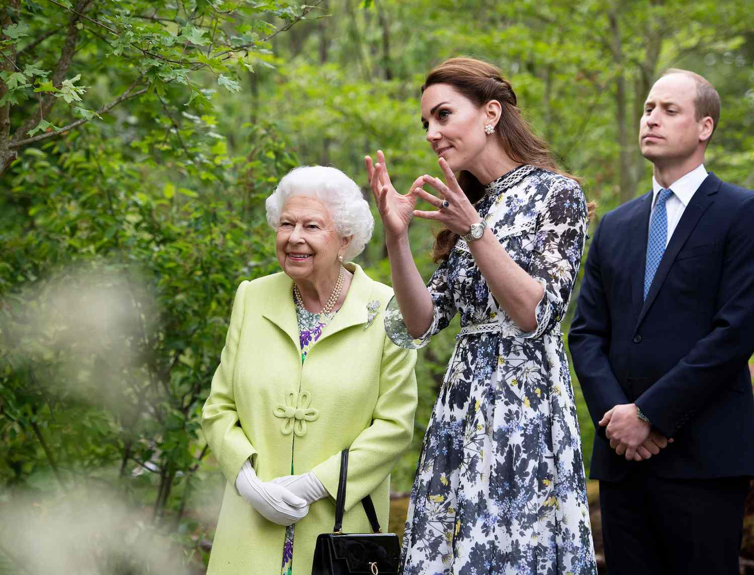 Queen Elizabeth II is shown around 'Back to Nature' by Prince William and Catherine Duchess of Cambridge