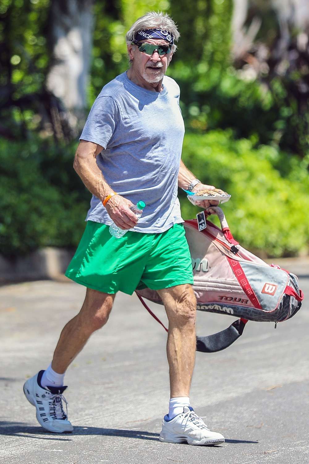 Harrison Ford heads out to a tennis match