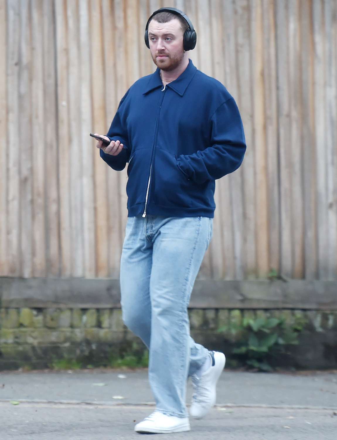 Sam Smith Looks Relaxed As They Stroll Through Hampstead Listening To Music On Headphones
