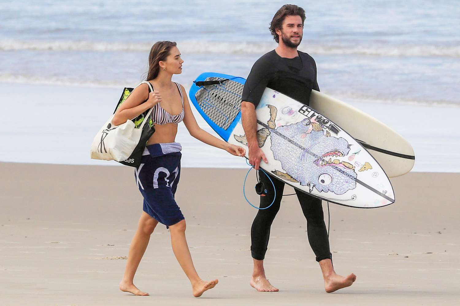 Surfs Up for Chris & Liam Hemsworth! The Hemsworth brothers reunite in Byron Bay, with Liam's bikini-clad girlfriend, model Gabriella Brooks, along for the action!