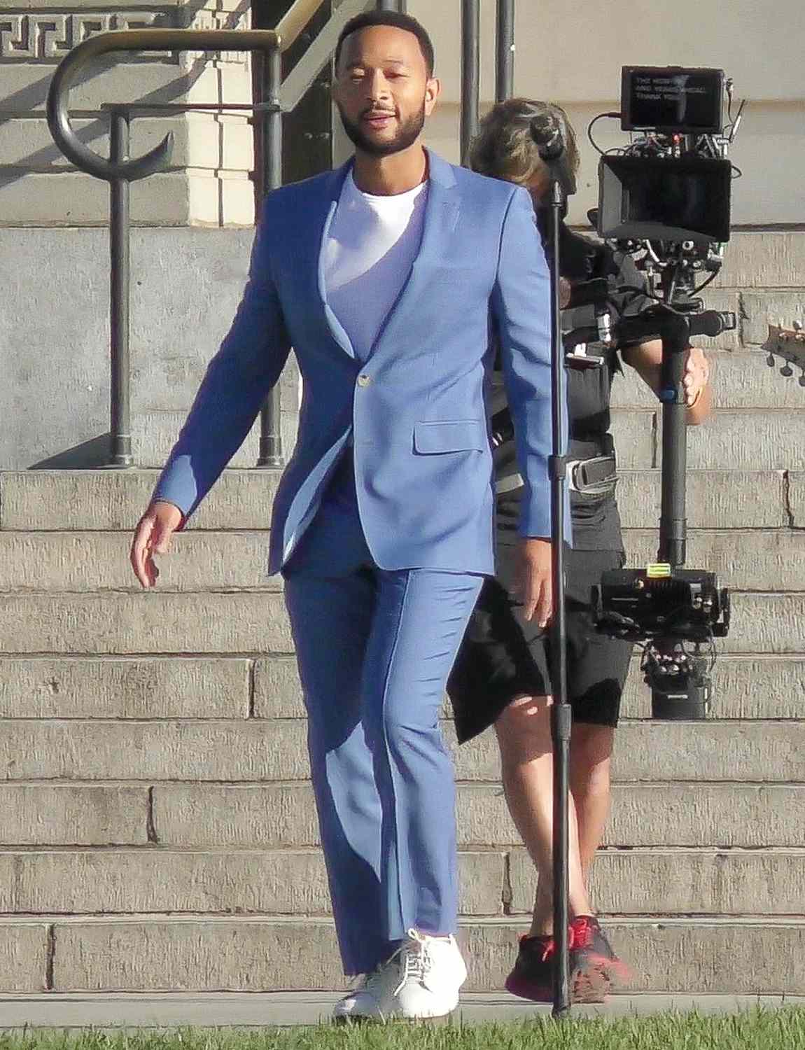 John Legend rocks a blue suit while shooting a music video
