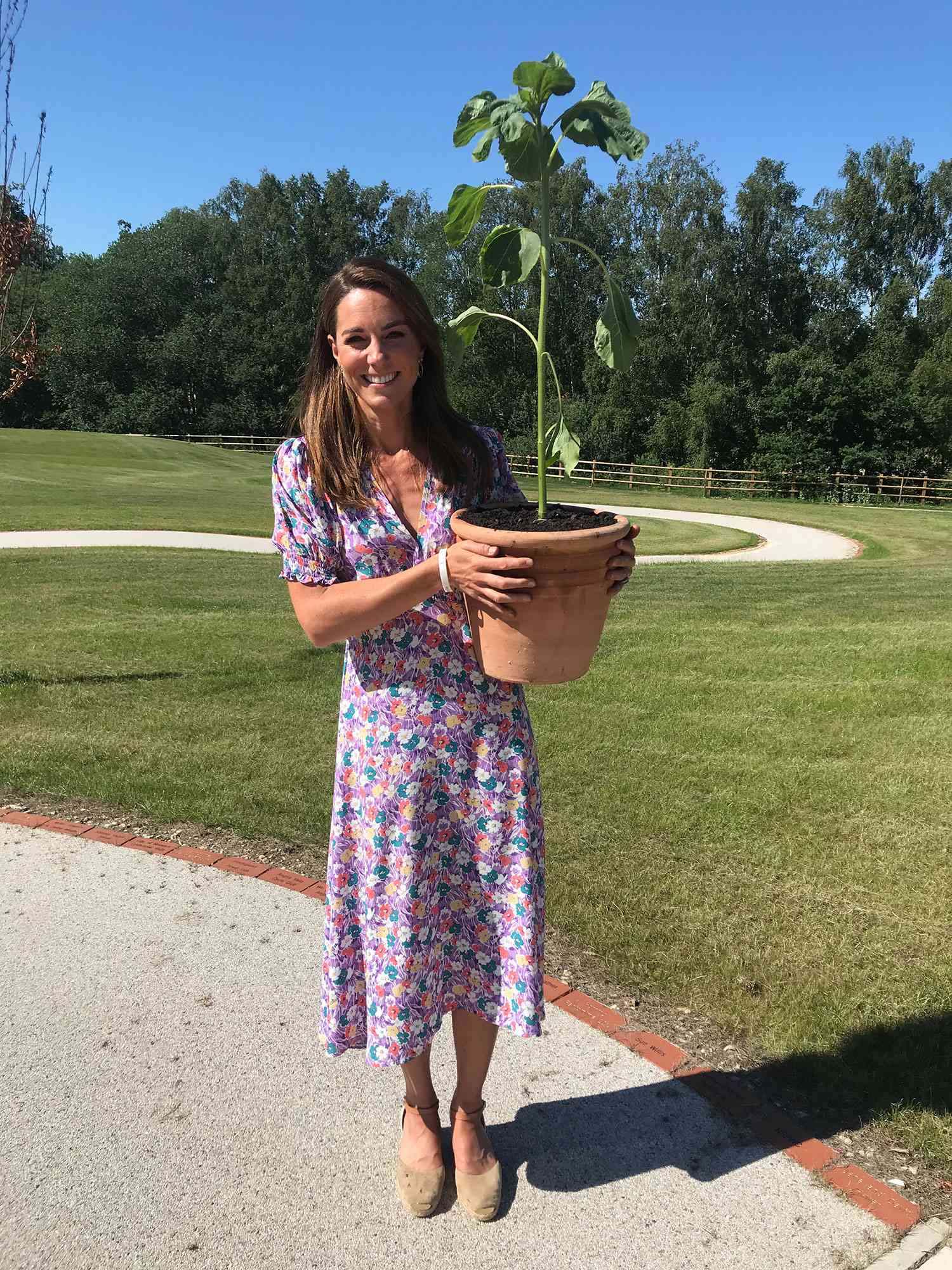 Kate Middleton Plants Sunflower in Memory of a Boy | PEOPLE.com