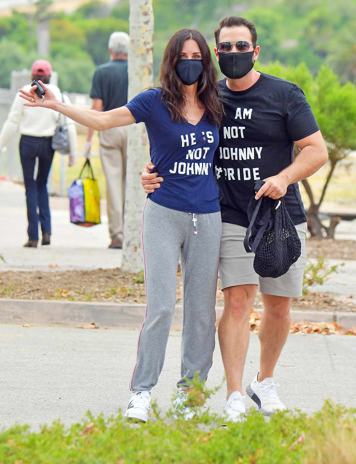 Courteney Cox makes it clear that the guy she's with is NOT Johnny McDaid