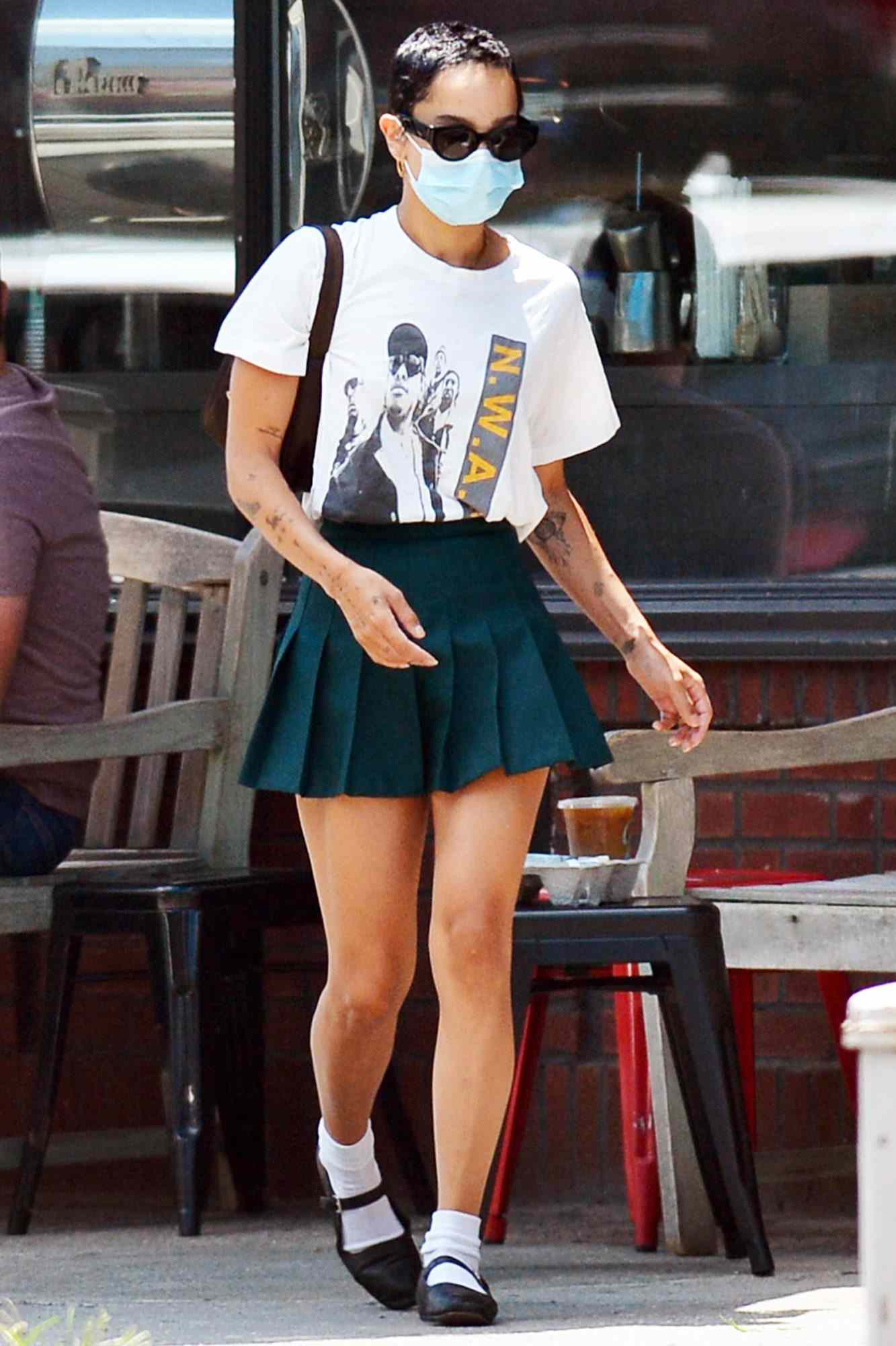 Zoe Kravitz Heads Out For Coffee Wearing a Graphic Anti Police T-shirt in New York City.