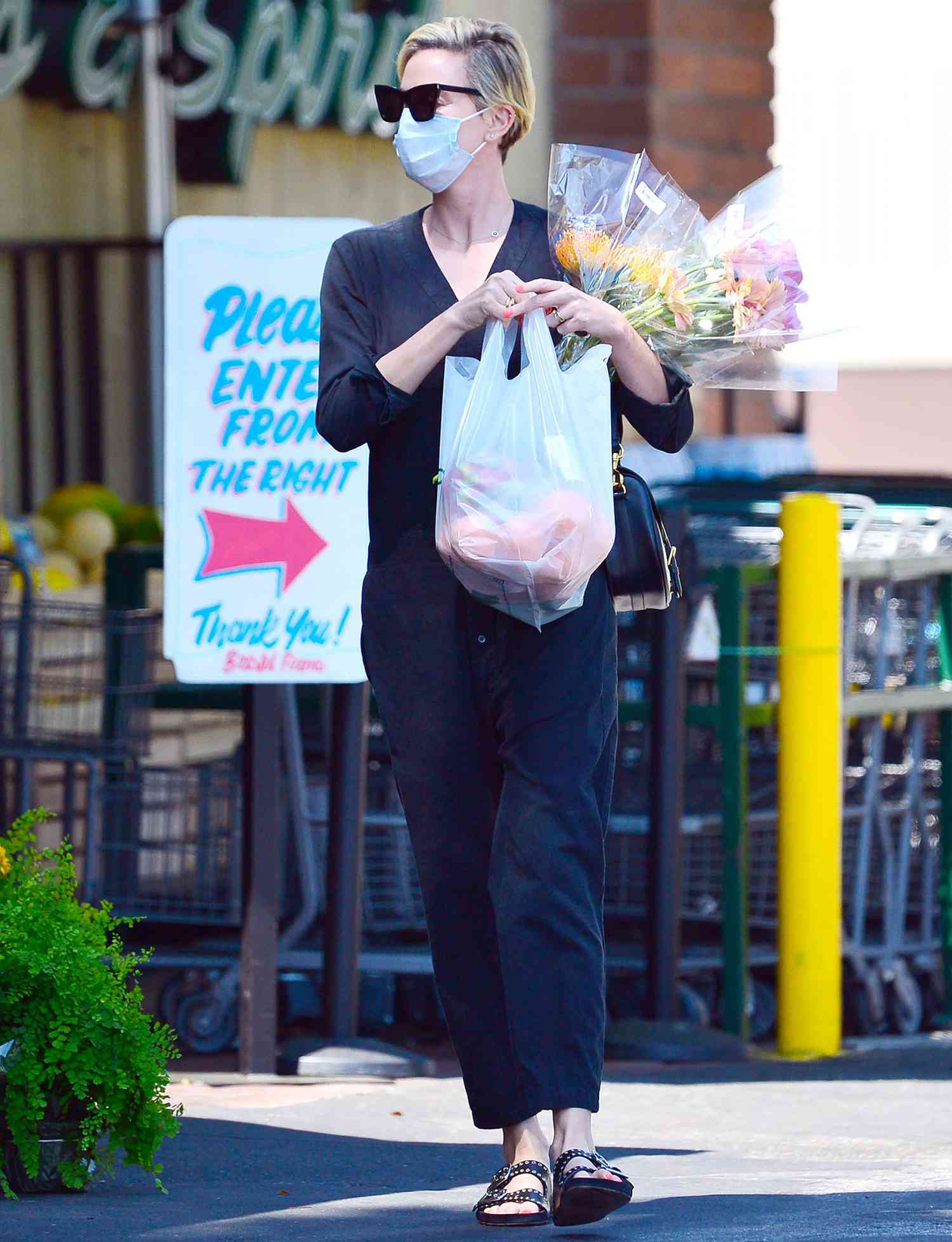 Charlize Theron Heads to a Grocery Store for a Large Variety of Flowers in Los Angeles.