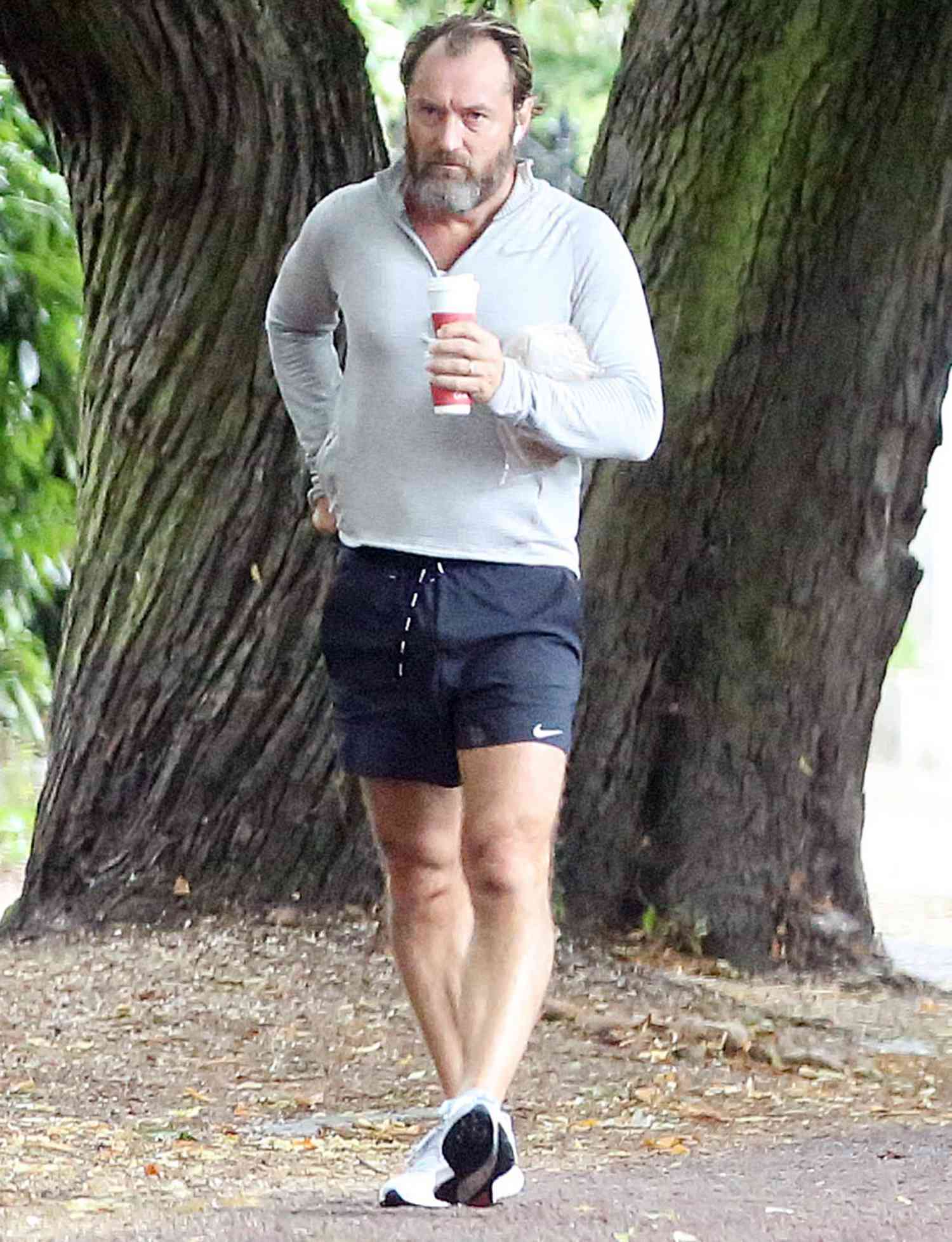 Jude Law returns with coffee after a early morning run
