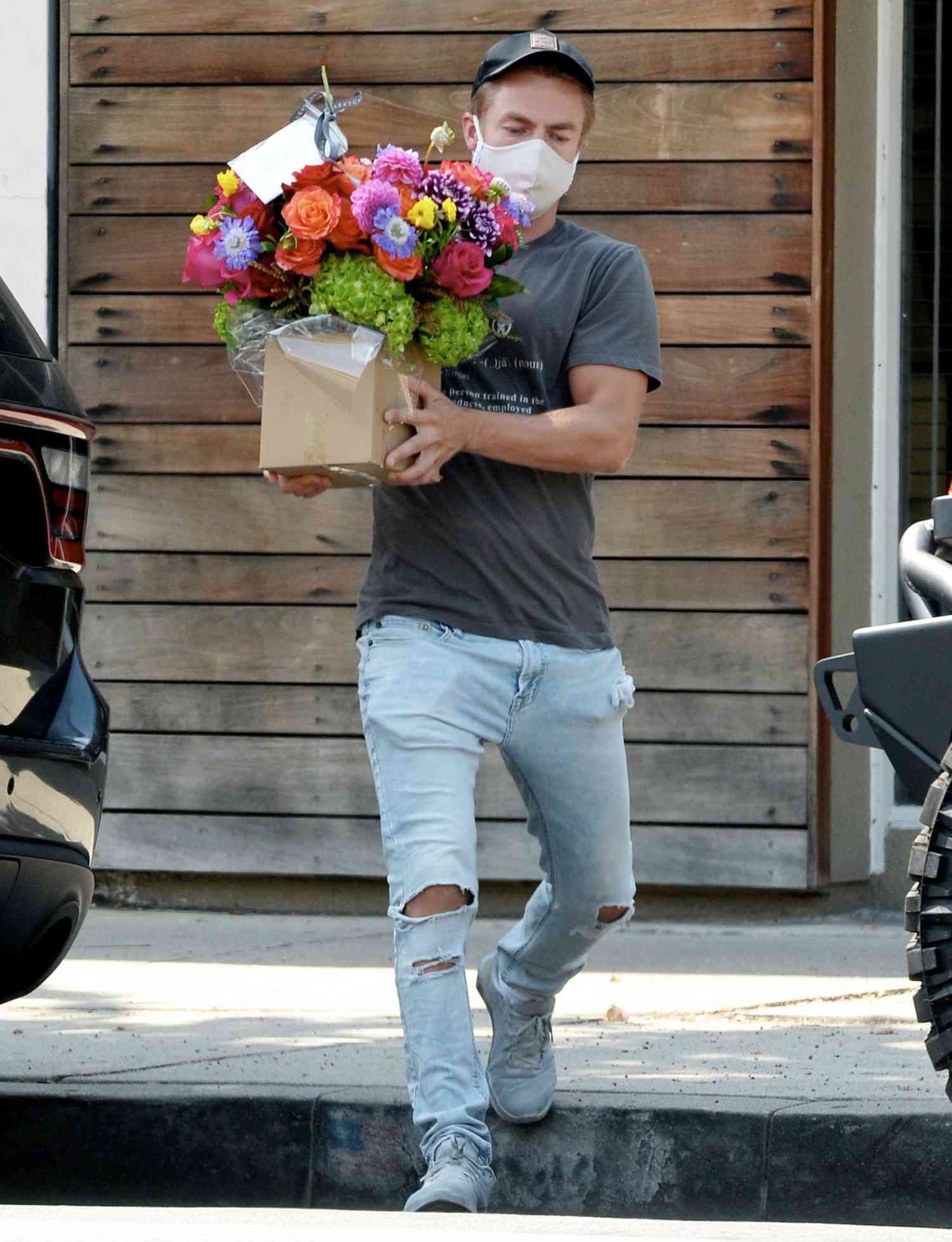 Derek Hough is Spotted With a Large Bouquet of Flowers in Los Angeles