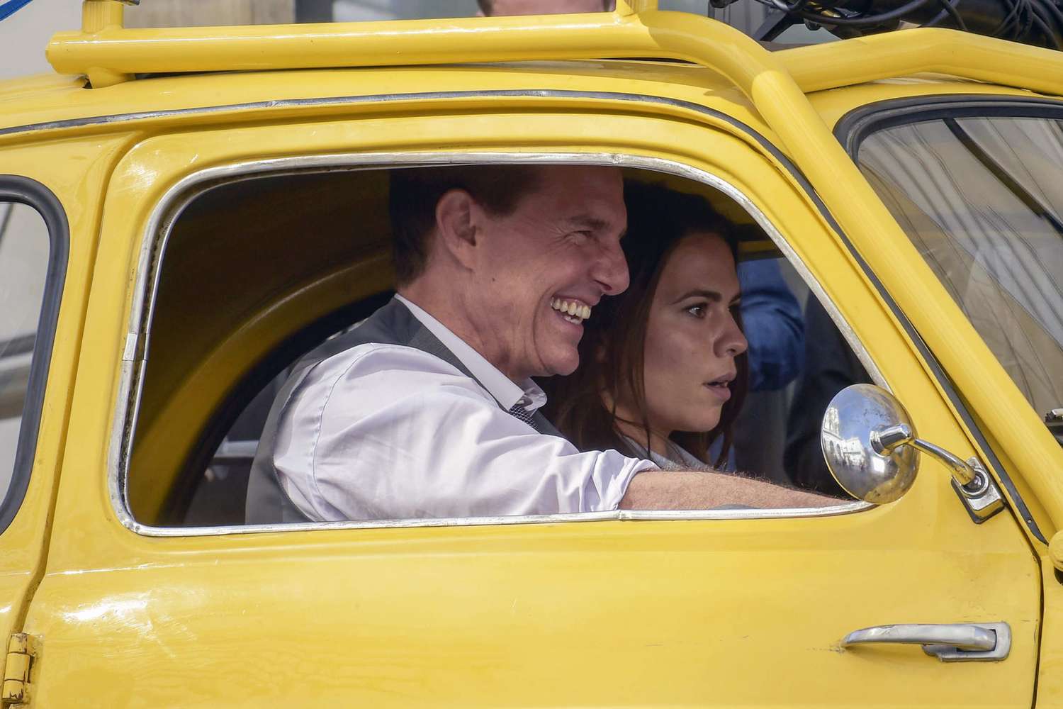 Tom Cruise and Hayley Atwell filming Mission Impossible 7 in a yellow Cinquecento in Rome