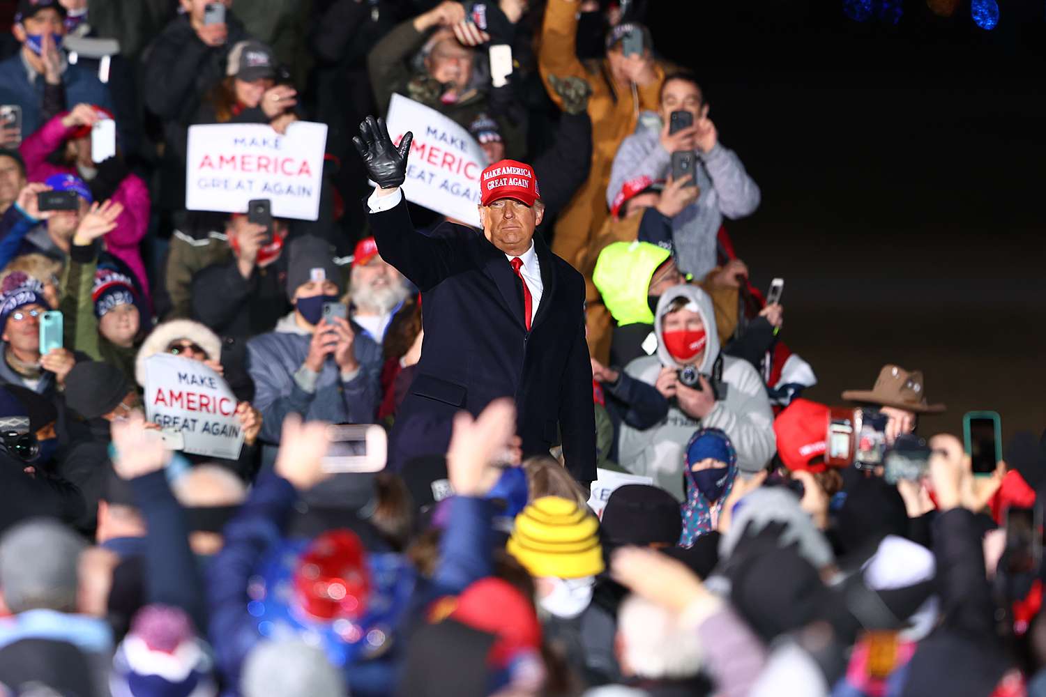 US President Donald Trump waves to supporters during a campaign rally on November 2, 2020 in Traverse City, Michigan