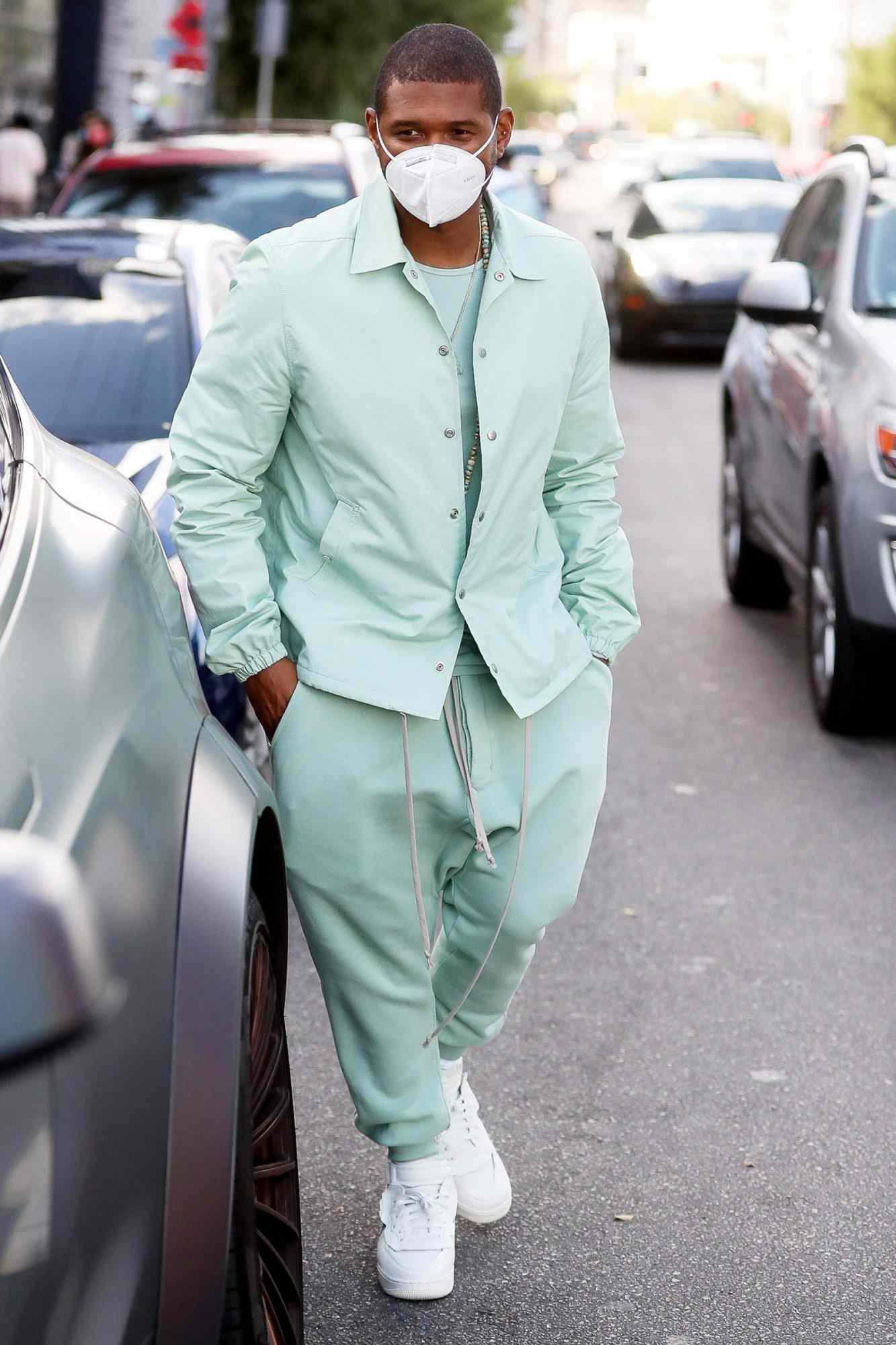 Usher looks stylish as he exits Kreation after lunch