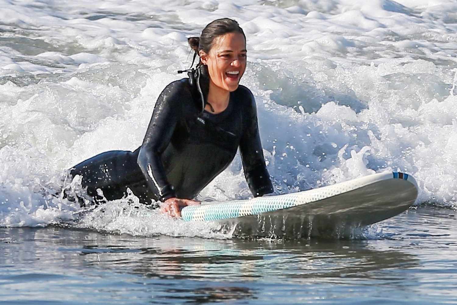 Michelle Rodriguez goes surfing with friends in Malibu