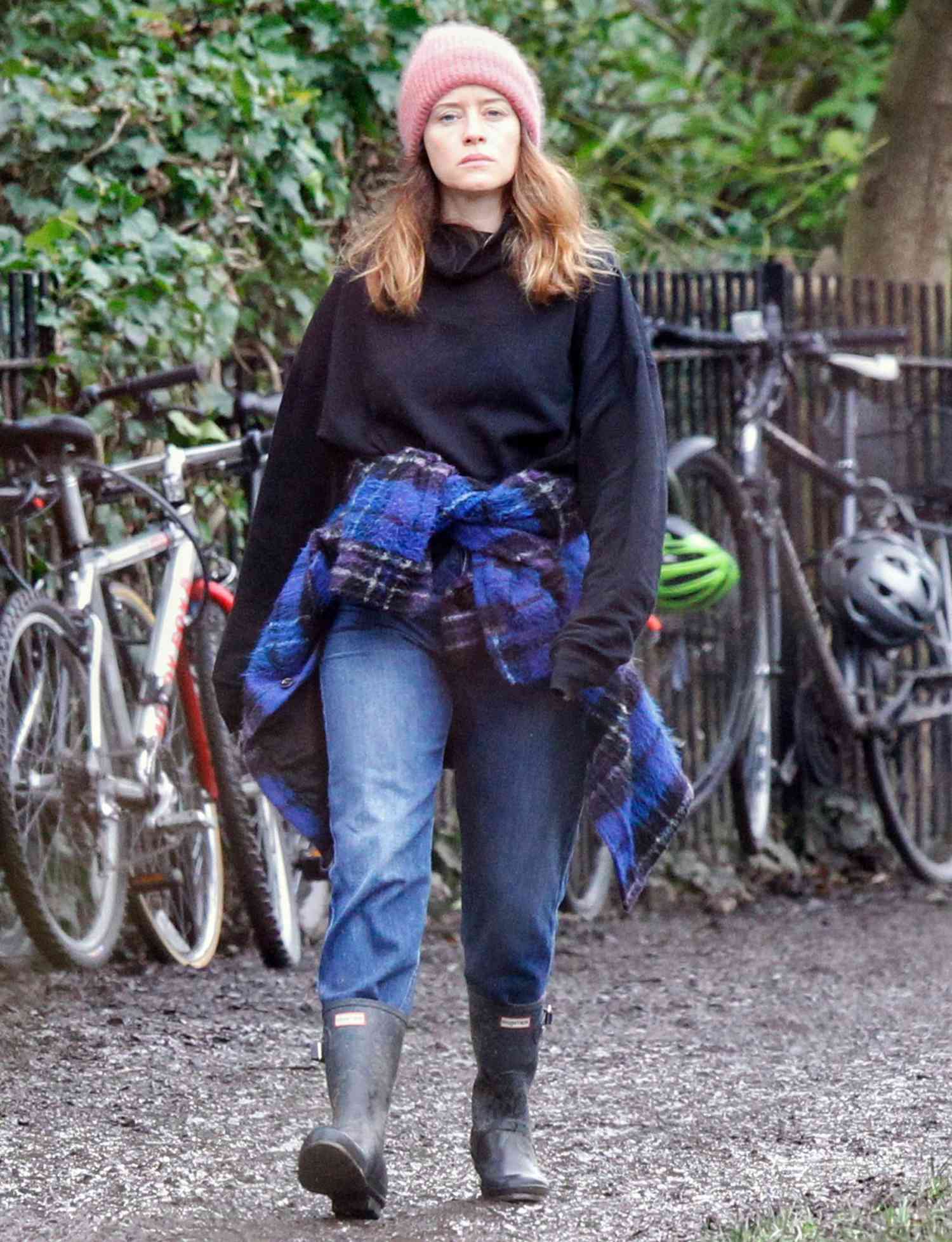 Actress Claire Foy Goes For A Soggy London Stroll Wearing A Pair Of Hunter Wellington Boots.