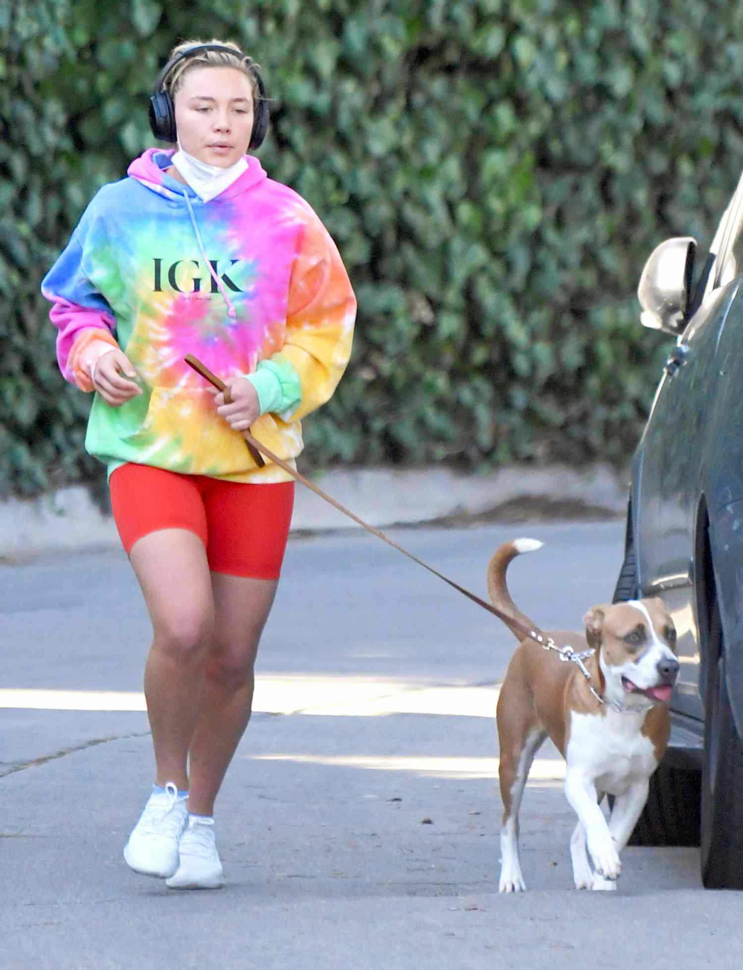 Florence Pugh Takes A Jog In A Colorful Hoodie As Romance Between Her "Don't Worry Darling" Co-Stars Heats Up