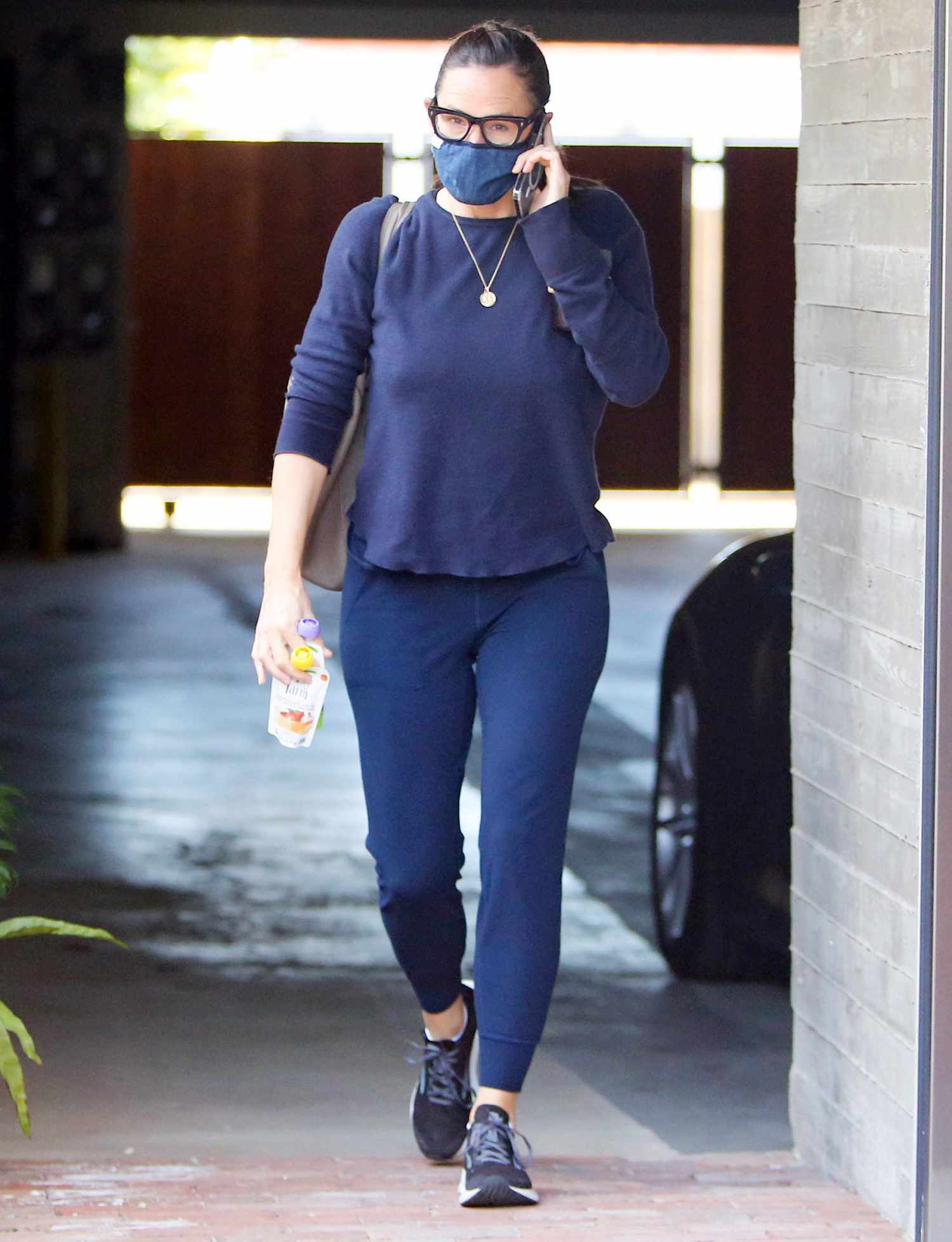 Jennifer Garner is seen exiting a parking garage on the phone