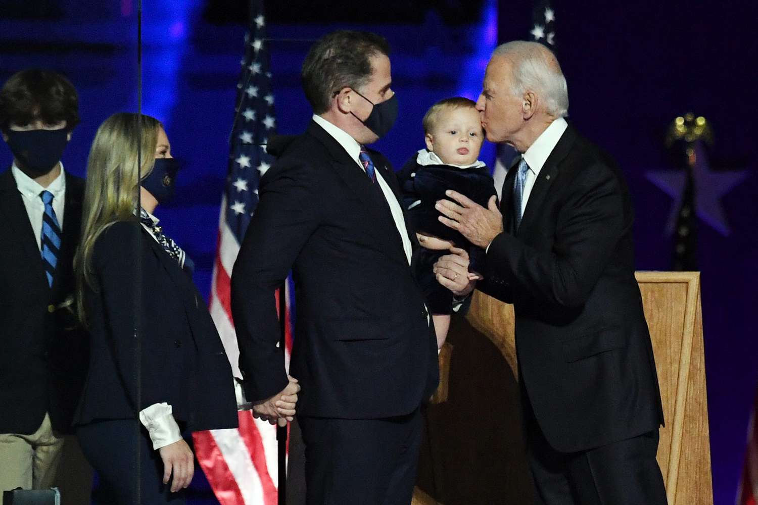 President-elect Joe Biden kisses his grandson as his son Hunter and wife Melissa Cohen look on as they celebrate onstage after Biden defeated Republican President Donald Trump in the 2020