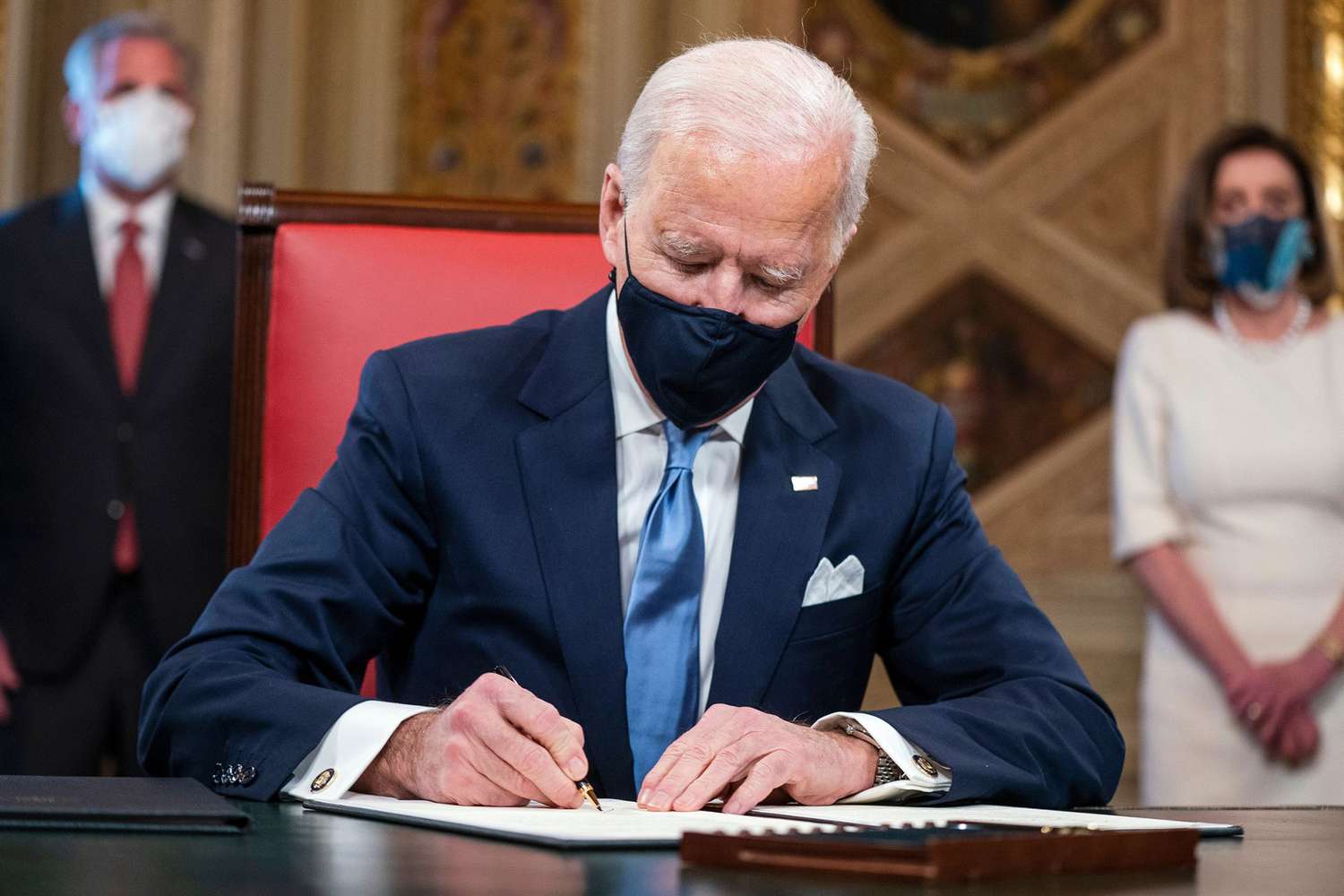 President Joe Biden signs three documents including an inauguration declaration, cabinet nominations and sub-cabinet nominations in the President's Room at the US Capitol after the inauguration ceremony, at the U.S. Capitol in Washington