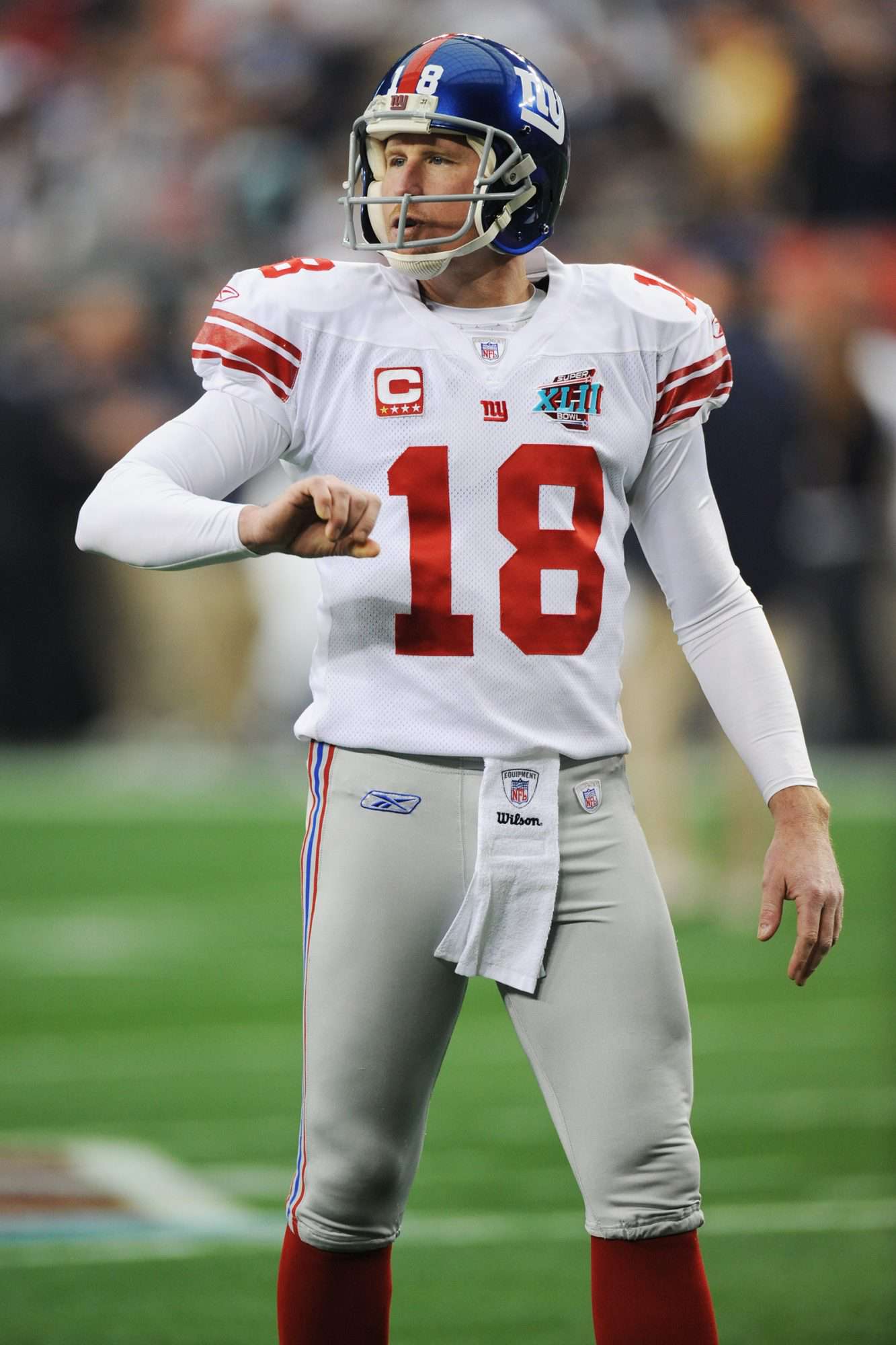 Jeff Feagles #18 of the New York Giants participates in warm-ups before Super Bowl XLII