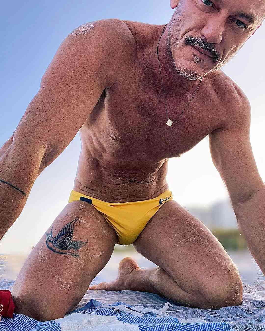 Kreta straal Goed Luke Evans Shows Off New Leg Tattoo in Speedo Selfie | PEOPLE.com
