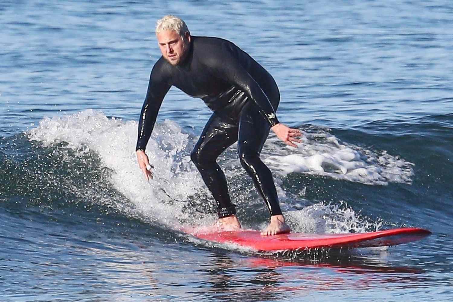 Jonah Hill shows off his tattoed surfer body after a surfing session on a windy California morning!