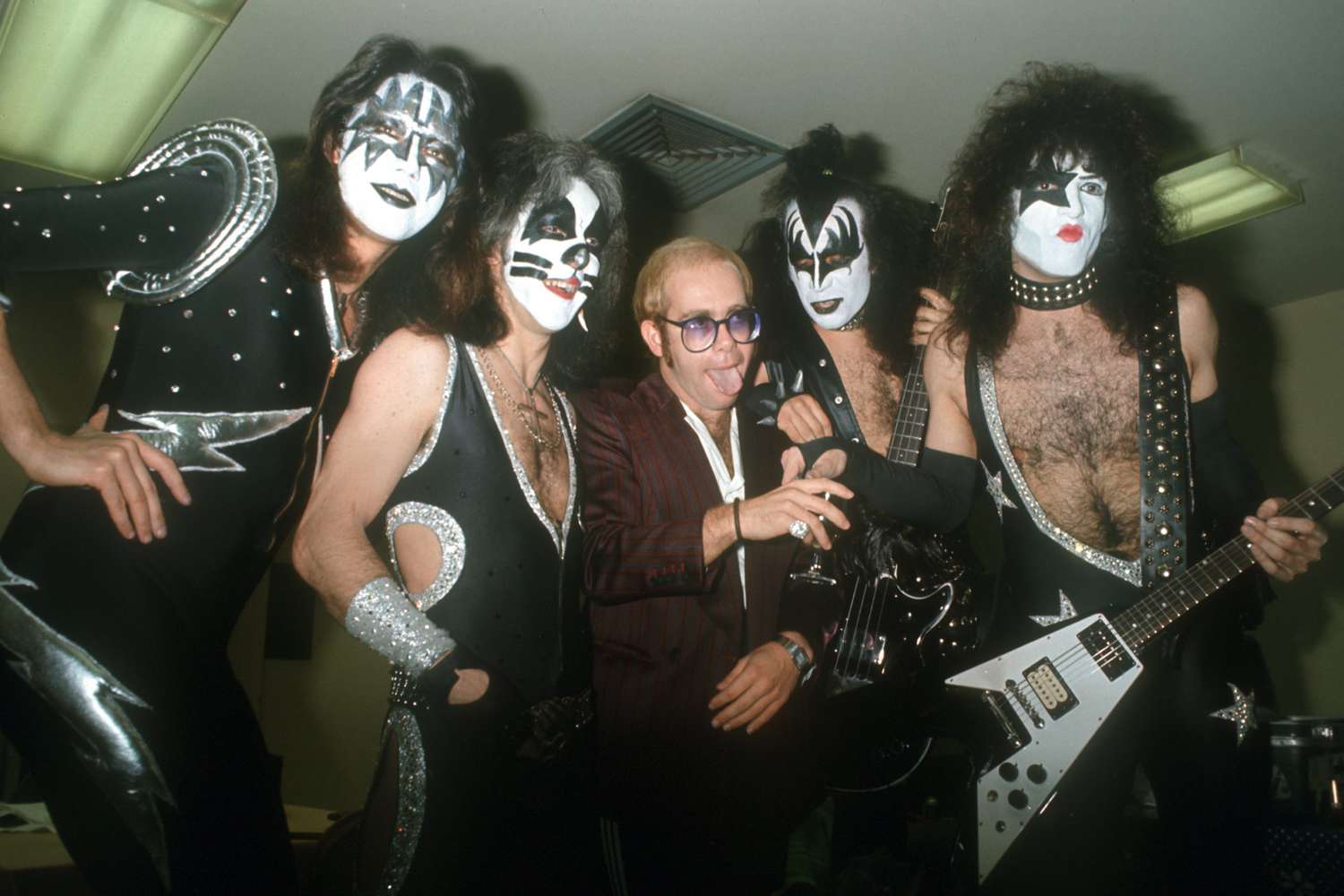 Pop singer Elton John poses for a portrait with the rock band 'Kiss' in full regalia in circa 1977 in Los Angeles, California. (L-R) Ace Frehley, Peter Criss, Elton John, Gene Simmons, Paul Stanley