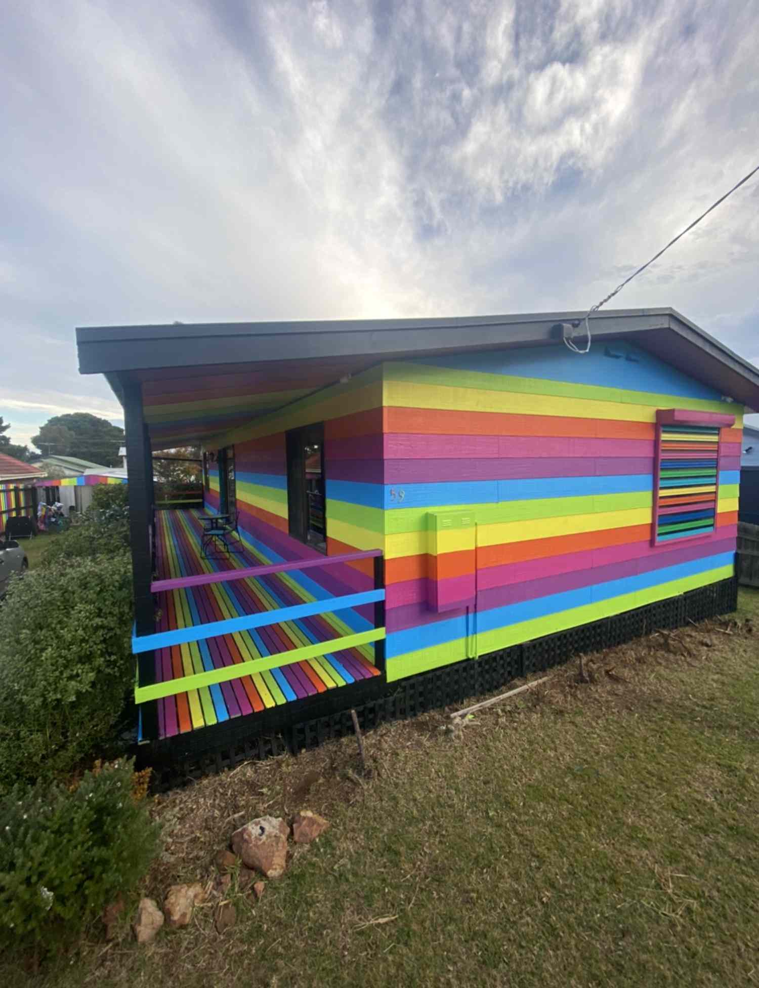 Neighbors Help Gay Man Paint House in Rainbow Stripes After He Faced Threats