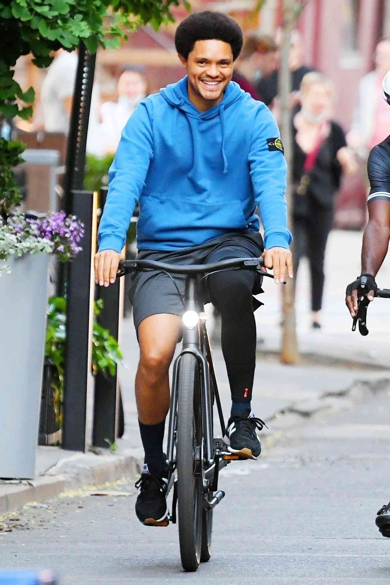 Newly single Trevor Noah bikes through West Village with two friends