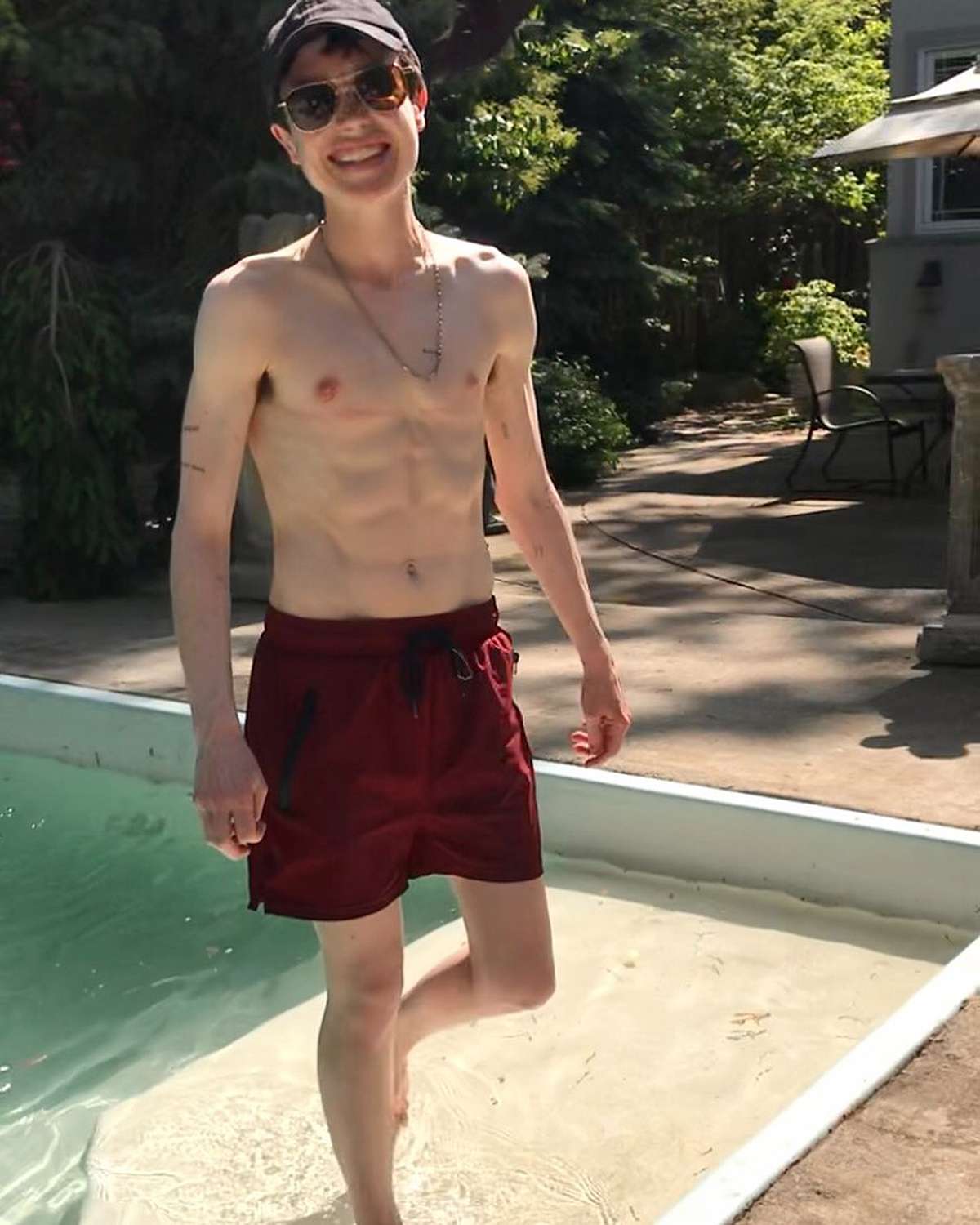Elliot Page Beams in Shirtless Poolside Shot | PEOPLE.com