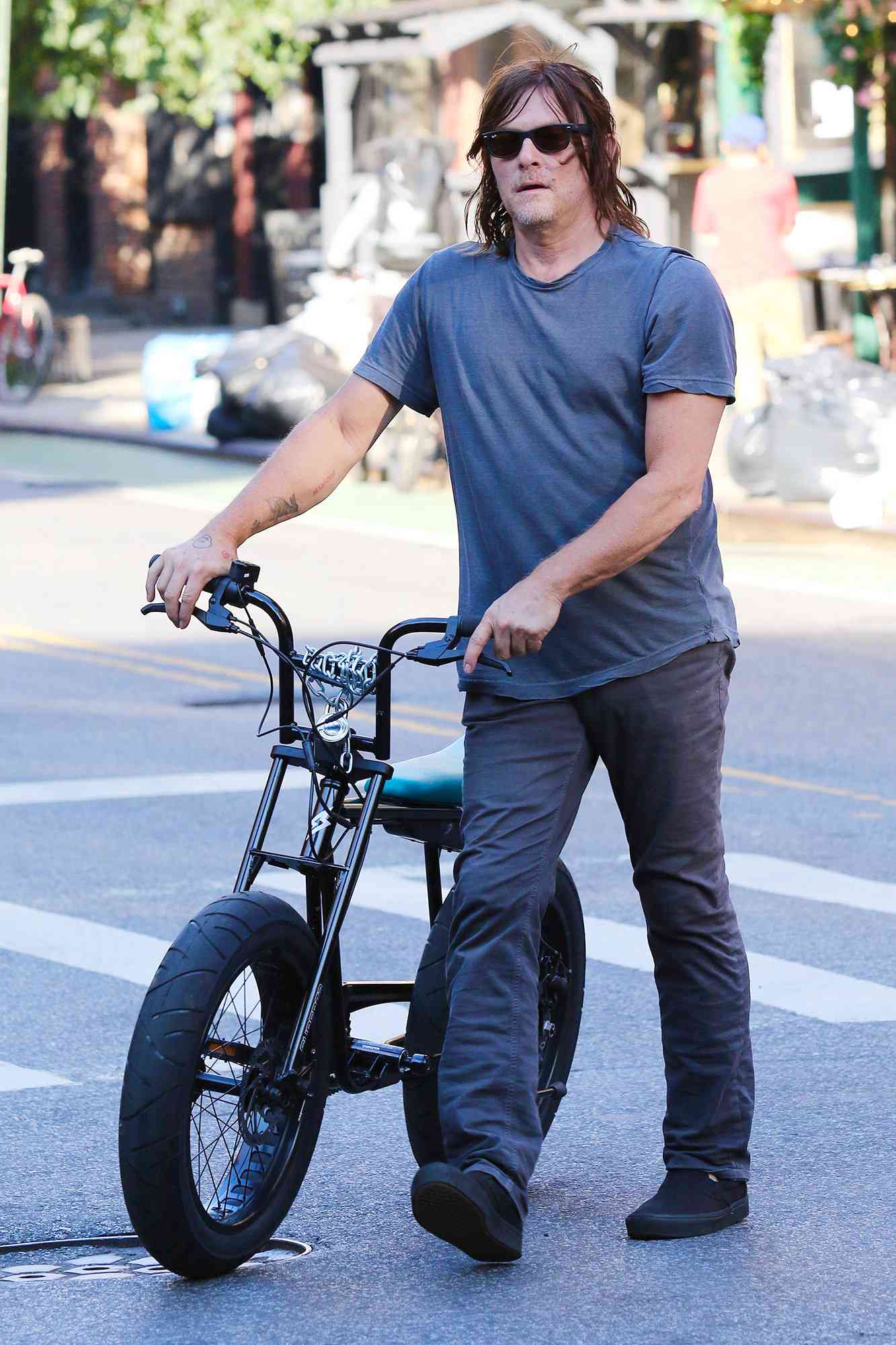 Norman Reedus walks home after a bike ride in Manhattan’s Downtown area