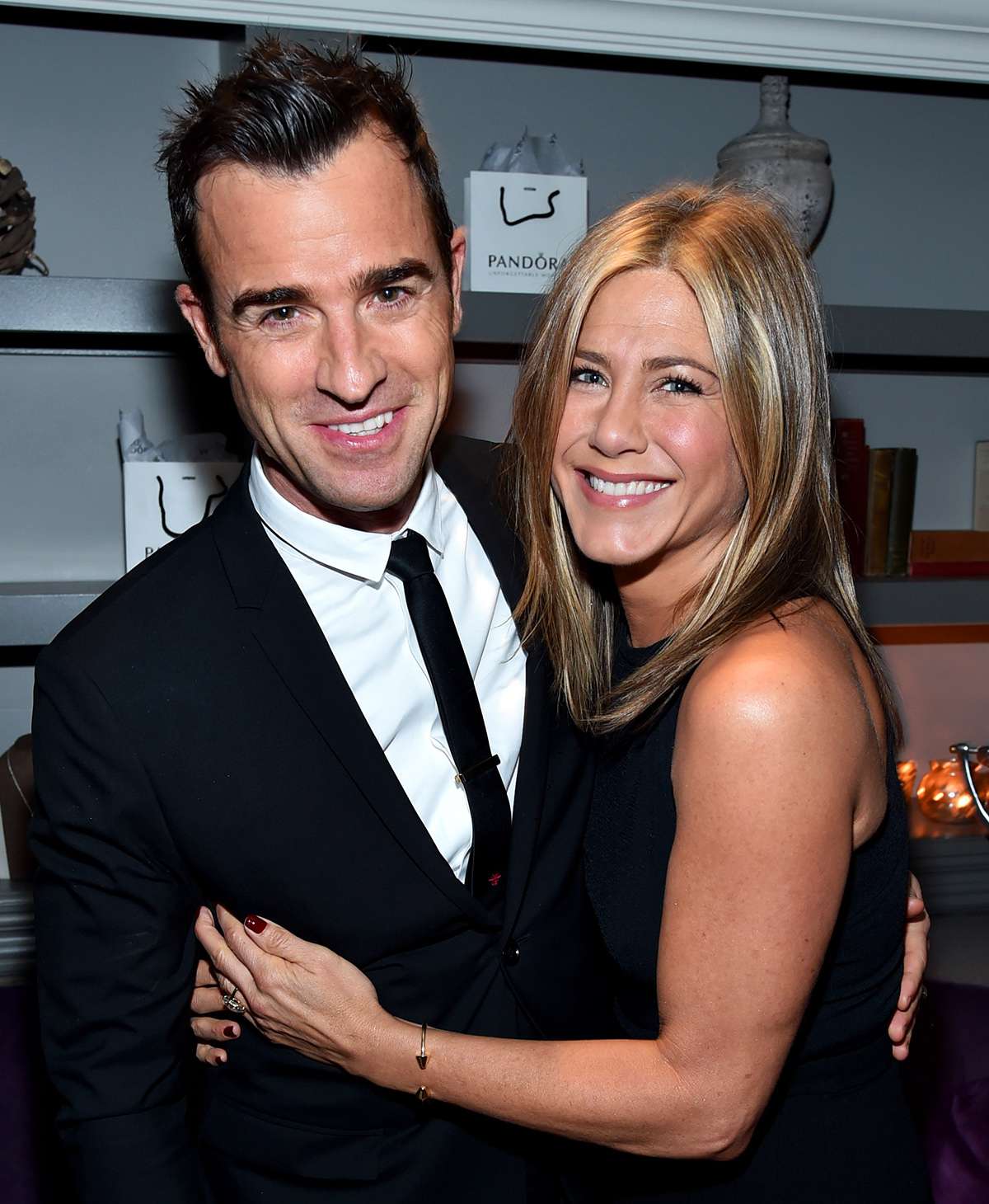 Justin Theroux (L) and actress/executive producer Jennifer Aniston attend the "Cake" cocktail reception presented by PANDORA Jewelry at West Bar on September 8, 2014