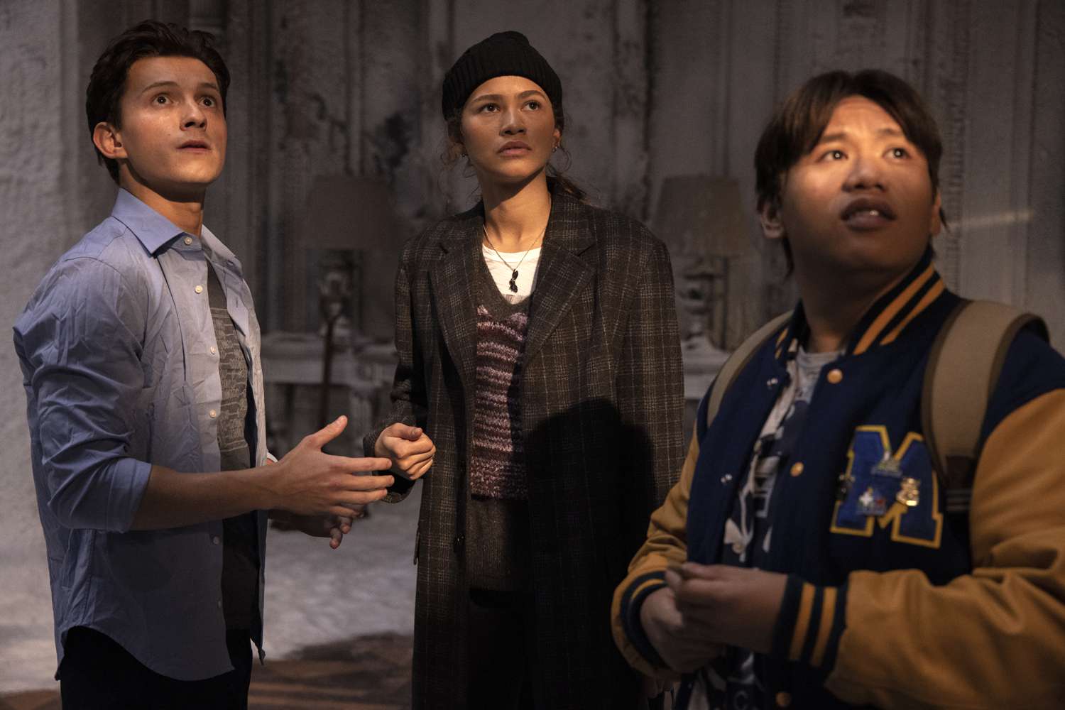 Tom Holland as spider-man (left), zendaya as mj (middle), and jacob batalon as ned leeds (right)