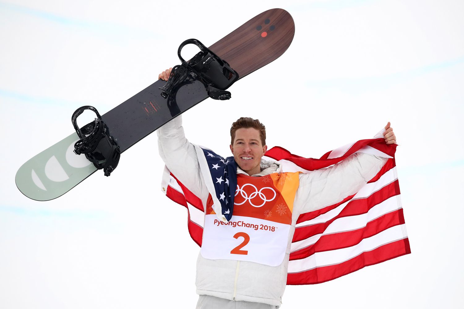 Shaun White of the United States poses during the victory ceremony for the Snowboard Men's Halfpipe Final