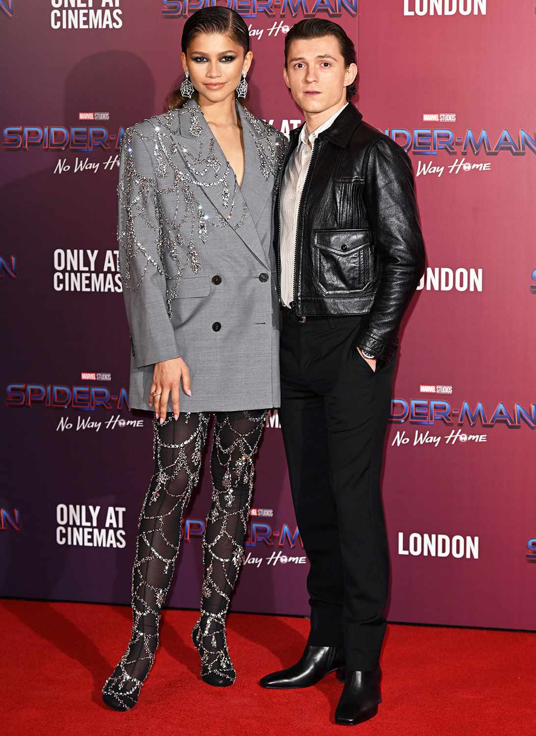 Zendaya and Tom Holland attend a photocall for "Spiderman: No Way Home" at The Old Sessions House on December 05, 2021 in London, England.