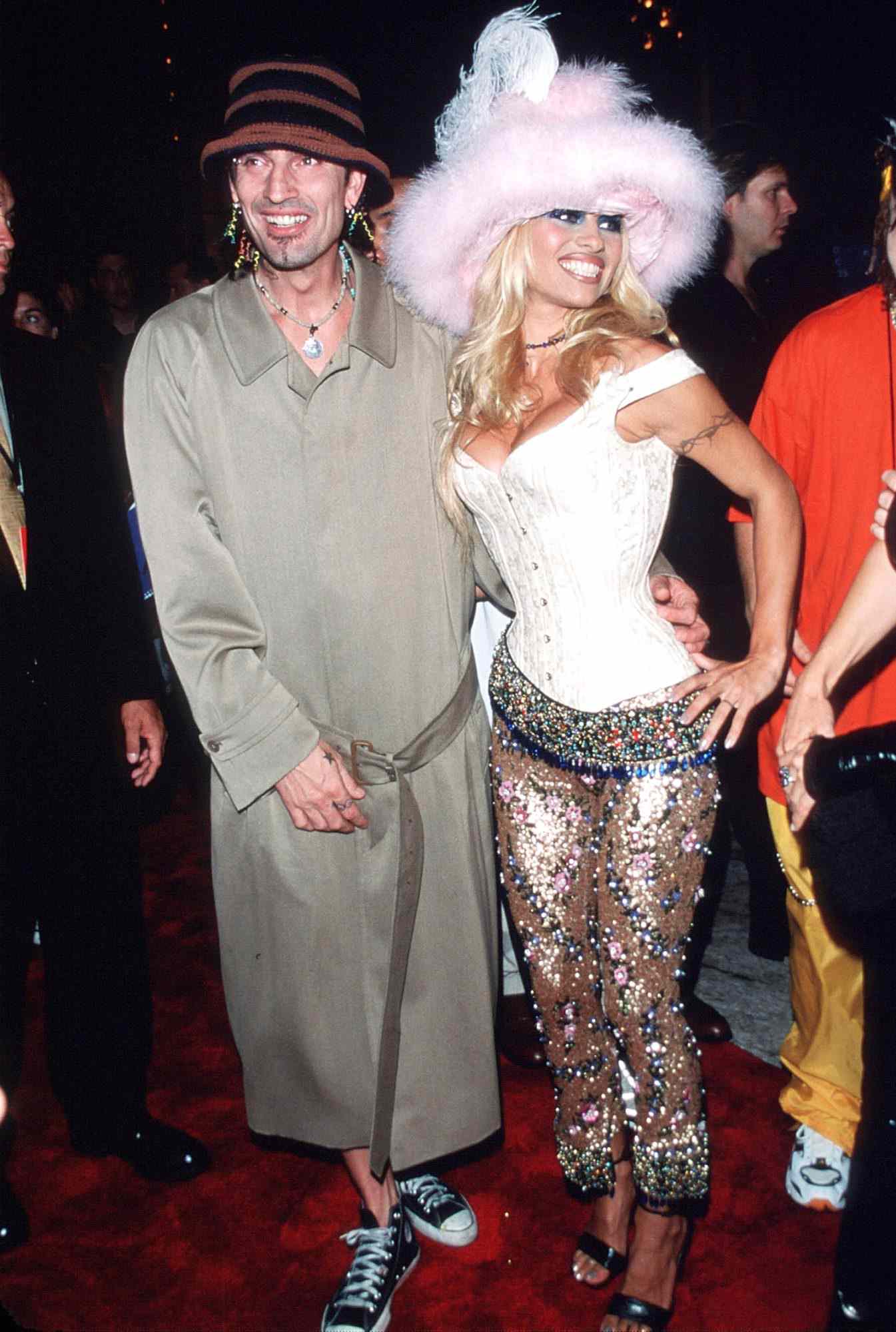 Pamela Anderson poses for a picture with husband Tommy Lee on September 9, 1999 at the MTV Video Music Awards