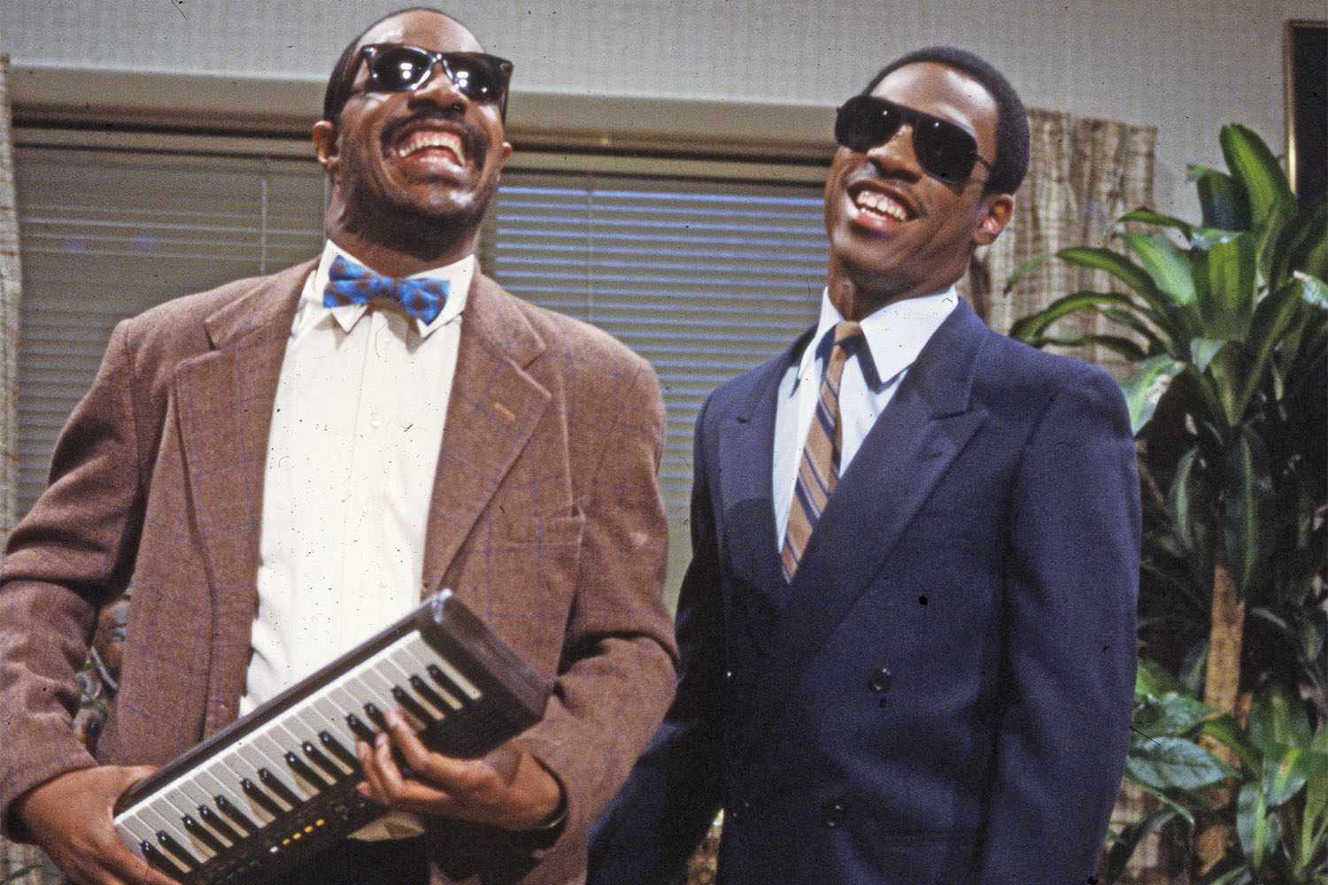 American musician Stevie Wonder appears on an episode of 'Saturday Night Live' with comedian and actor Eddie Murphy (dressed as Stevie Wonder), New York, New York, 1983. (Photo by Anthony Barboza/Getty Images)