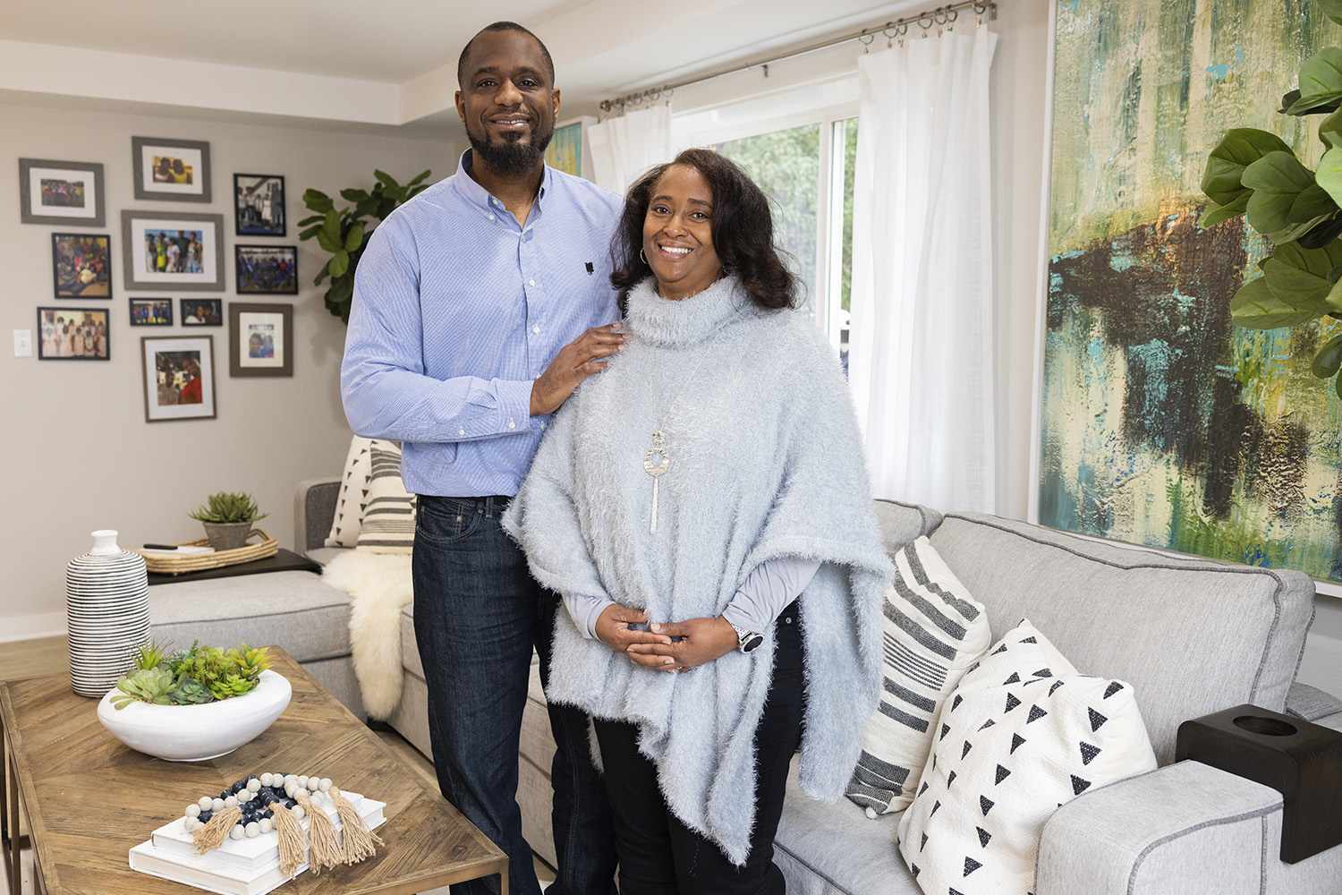 As seen on HGTV's Home Town Kickstart, homeowners Tonia and Marlon Brown pose in their newly renovated basement living space in Thomaston, GA. (Portrait Home) January 21, 2022 Credit: Courtesy HGTV
